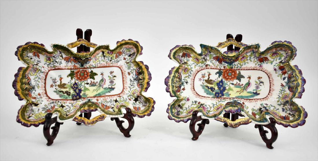 PAIR OF ENGLISH SHAPED IRONSTONE TRAYS: Possibly Masons, Staffordshire. Early to mid 19th Century. The shaped rectangular trays with double handles, decorated in an Asian style with allover foliage, the center recess with exotic birds amids