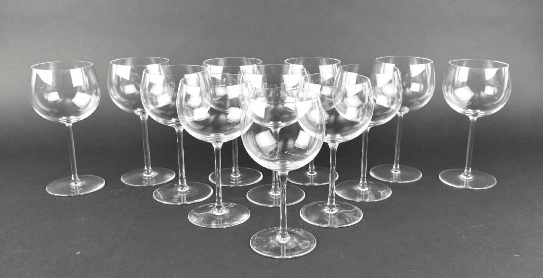 SET OF TWELVE VAL ST. LAMBERT RED WINE GLASSES: The underside with etched monogram. The colorless glass with circular bell-shaped bowls and a circular foot. Height 7.5 in. Diameter 3.5 in. (Cond: good)