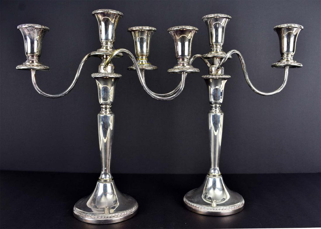 PAIR OF SHEFFIELD SILVER ON COPPER 3-LIGHT CANDELABRA: 20th Century. The removable three-light arm, above a tapered standard on a circular foot. Height 13.75 in. Width 13.75 in. (Cond: good)
