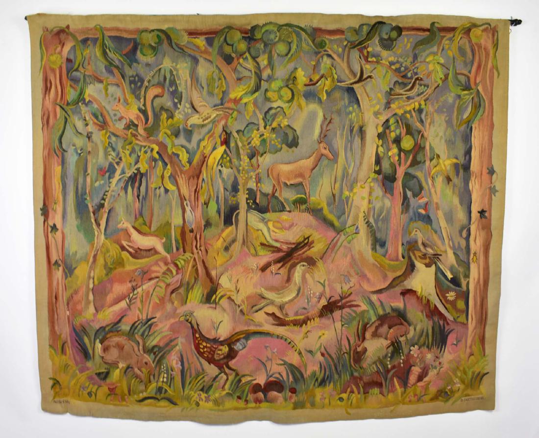 ARTS & CRAFTS AUBUSSON FOREST TAPESTRY: Circa 1900. The lower left margin stitched Aubusson, beneath a stitched signature Jacques Las.. le, the lower right stitched G. Bascouleague. Depicting a woodsman gathering wood in a forest of fruitin