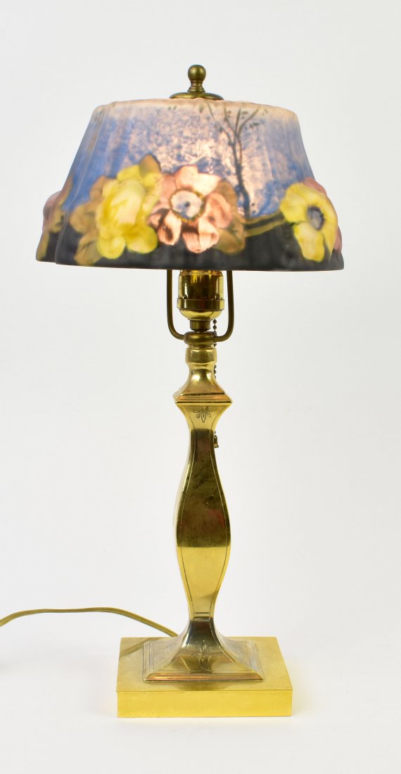 PAIRPOINT PAINTED PUFFY FLORAL GLASS BOUDOIR LAMP: The shade appears indistinctly to be marked THE PAIRPOINT CO., decorated with puffy flowers in pink and yellow on a painted blue ground, the brass base marked PAIRPOINT MFG. CO., with a P in a diamond