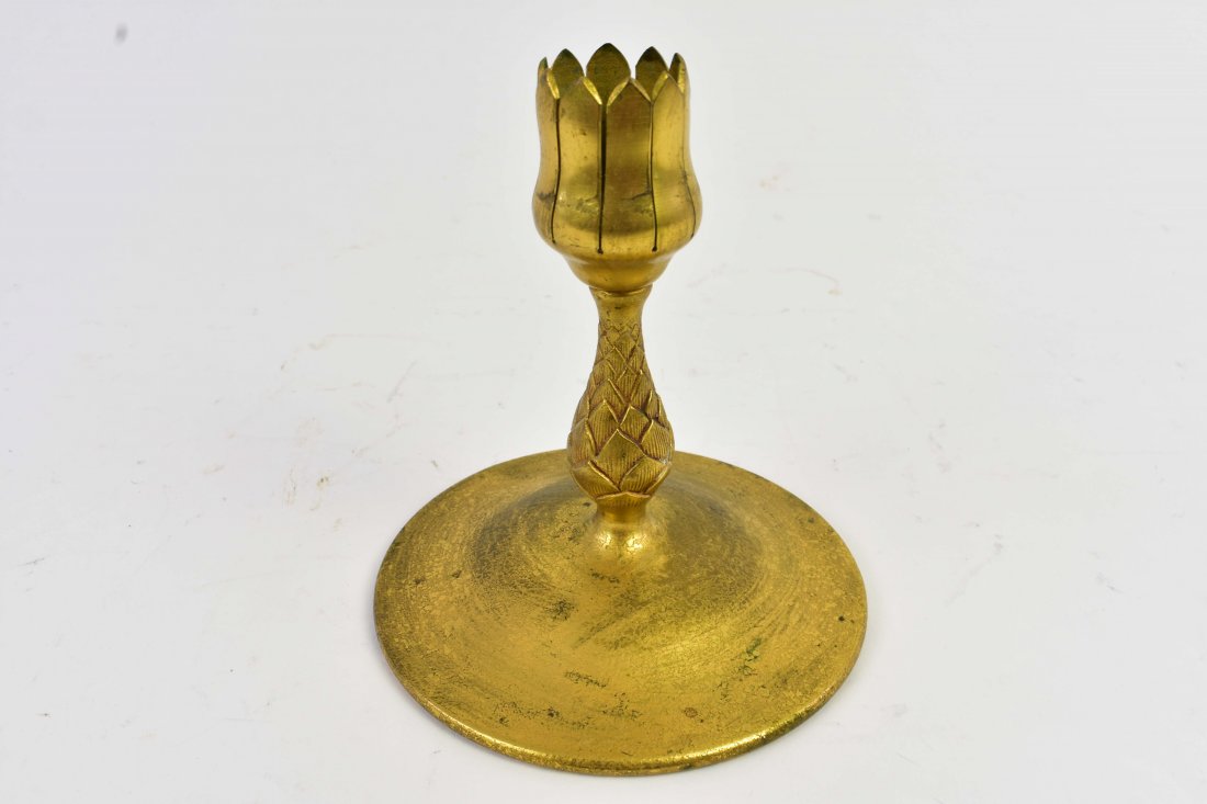 TIFFANY STUDIOS GILT BRONZE CANDLESTICK: Circa 1890. Marked Tiffany Studios New York, 1043.The baluster standard on a circular foot. Height 5.75 in. Diameter of foot. 5 in. (Cond: some rubbing to gilding, wear appropriate with age)