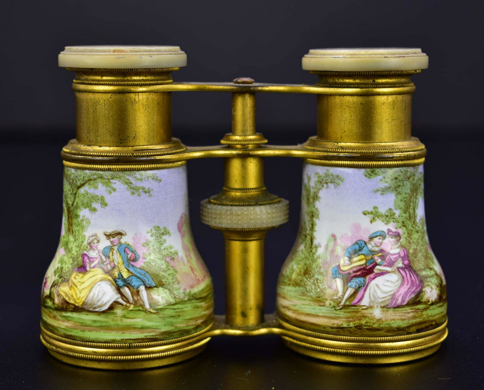 PAIR OF FRENCH ENAMEL AND BRASS OPERA GLASSES: Late 19th Century. The eyepieces mother-of pearl and marked A. PORTOIS & BLUM, PARIS.Decorated with figures in a garden setting. (Cond: good)