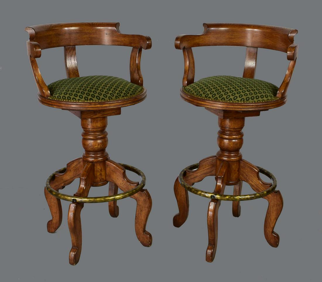 PAIR OF MAHOGANY CAPTAINâ€™S CHAIR-BACK STOOLS: Modern. Charles Pollock. Each curved chair-back, with a swiveling green fabric circular seat, on a turned standard with four scrolled feet. Height overall 42 in. Height seat to floor 30 in. (Cond: goo