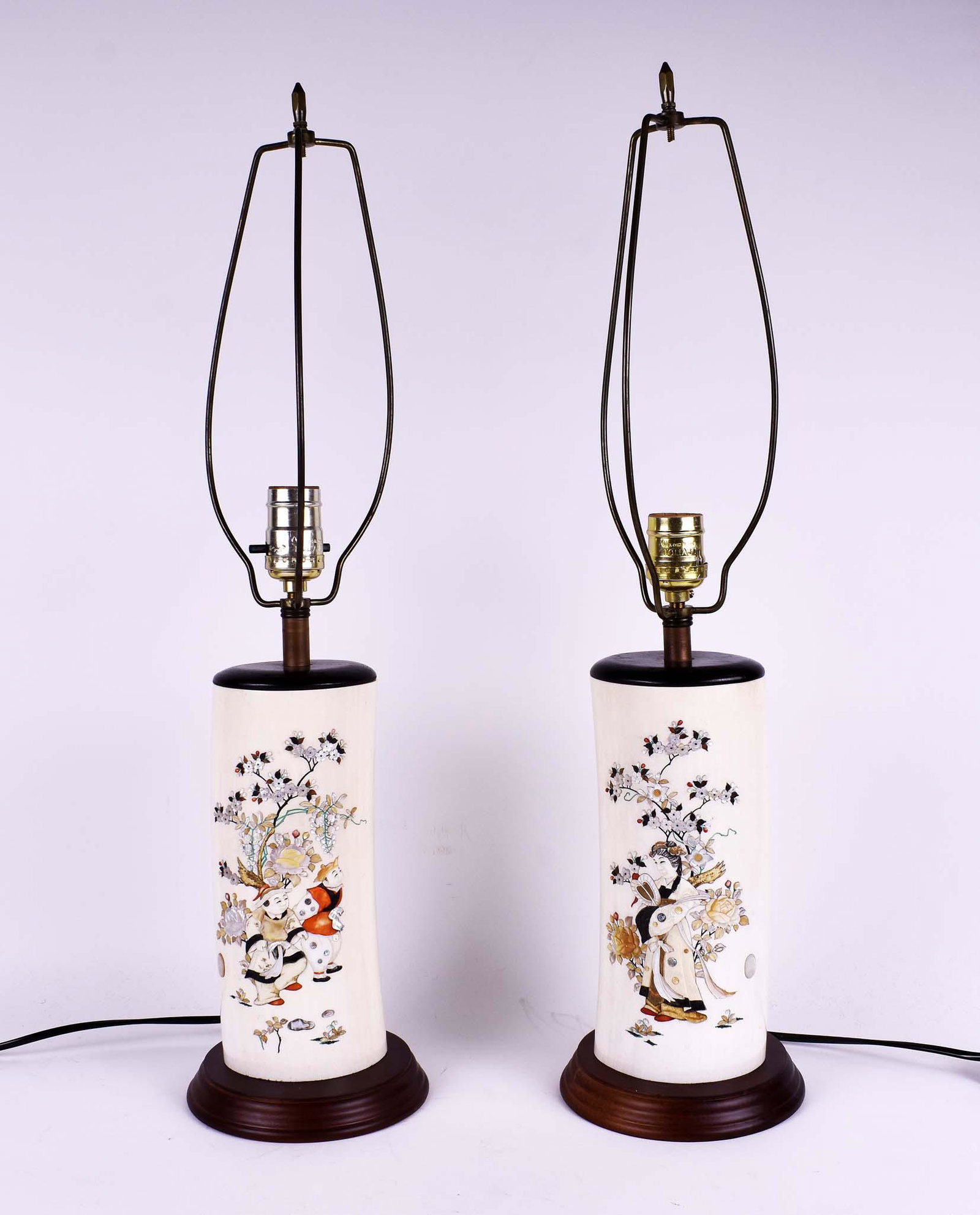 PAIR OF JAPANESE SHIBIYAMA VASES, MOUNTED AS LAMPS: Meiji Period. Each with a signed mother-of-pearl applied oval. One decorated with a young maiden, the other, two playful boys in colorful attire, all amongst blossoms and a tree, the reverse of each s