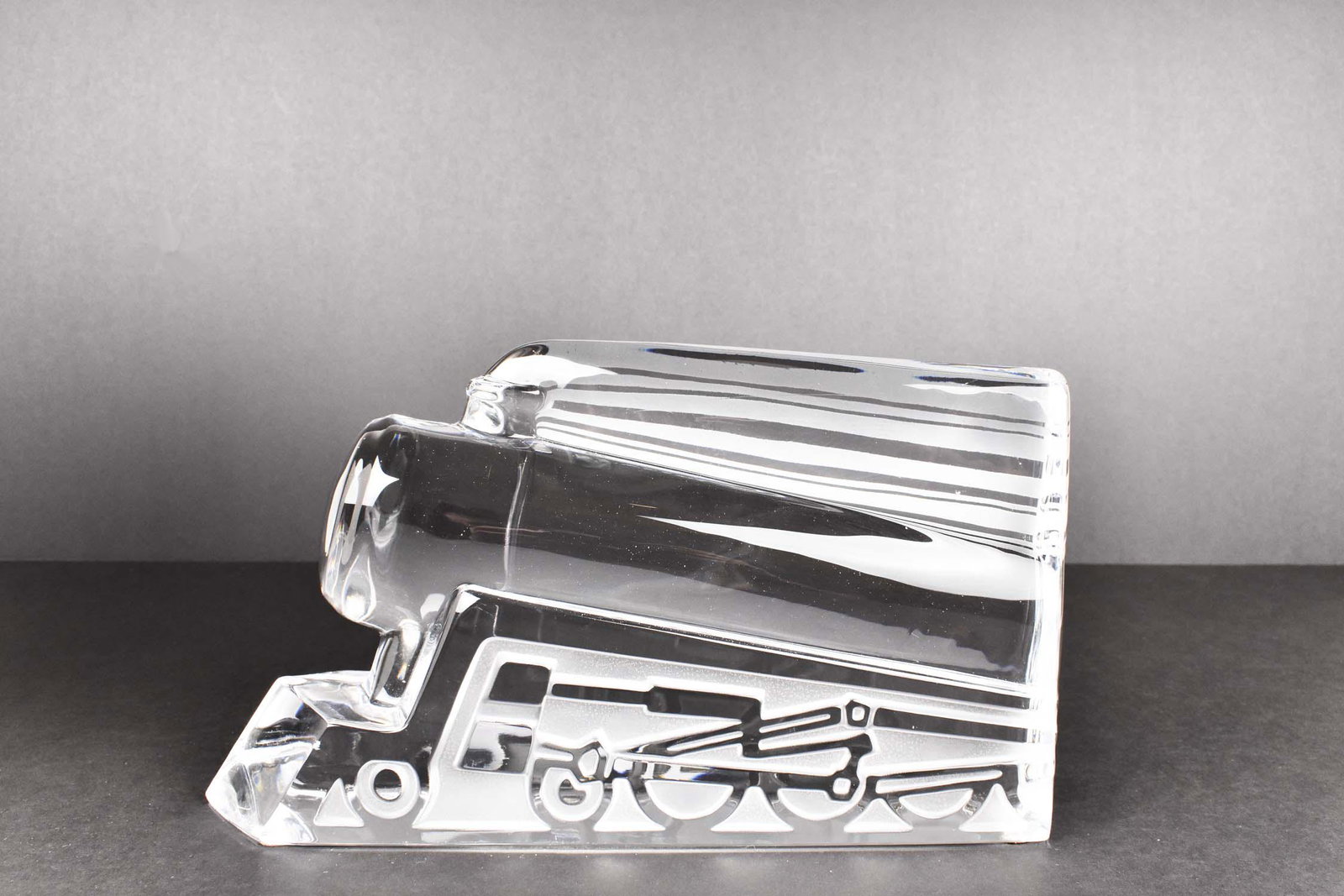 DAUM COLORLESS GLASS LOCOMOTIVE: 20th Century. Etched signature, Daum, France. Representing a stylized modernist locomotive. Height 6 in. Width 11 in. (Cond: good)