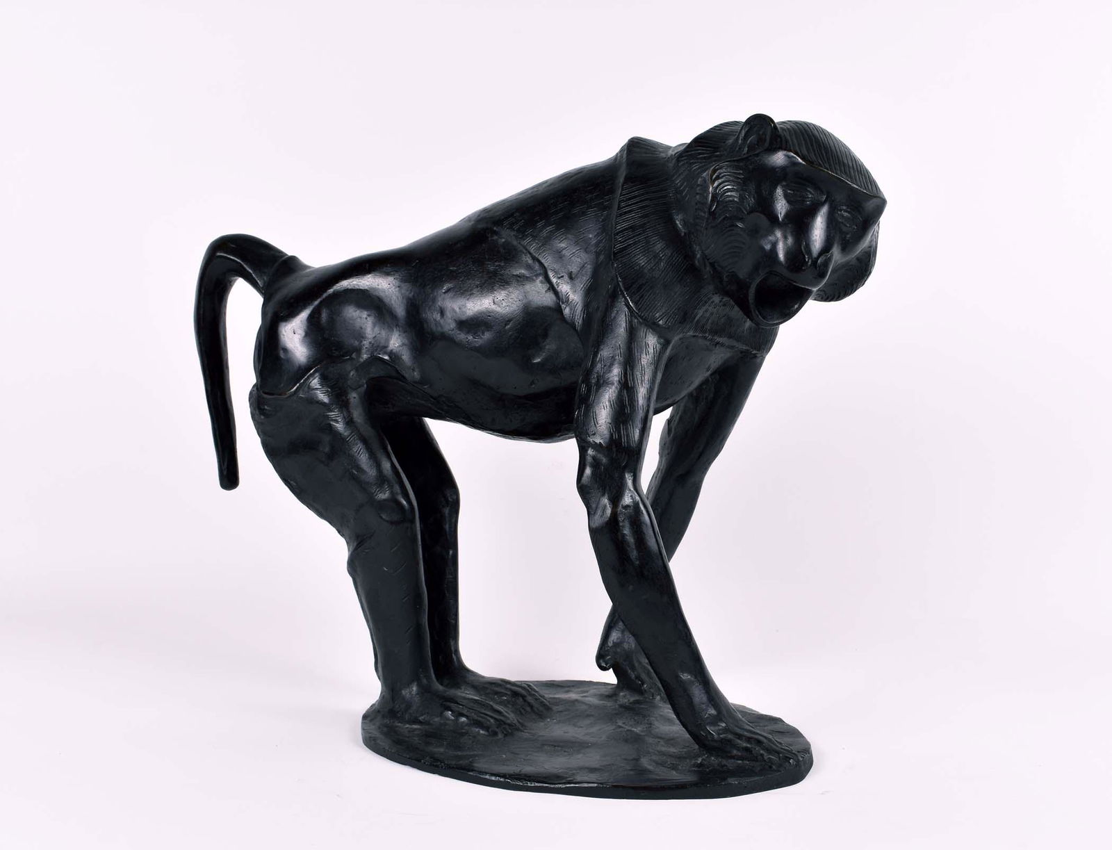 L. TOFORNARI PATINATED BRONZE OF A BABOON: Signed on the base L. Tofanari. Cast in the manner of a Rembrandt Bugatti baboon. Height 12.5 in. Width15 in. Depth 7.5 in. (Cond: good)