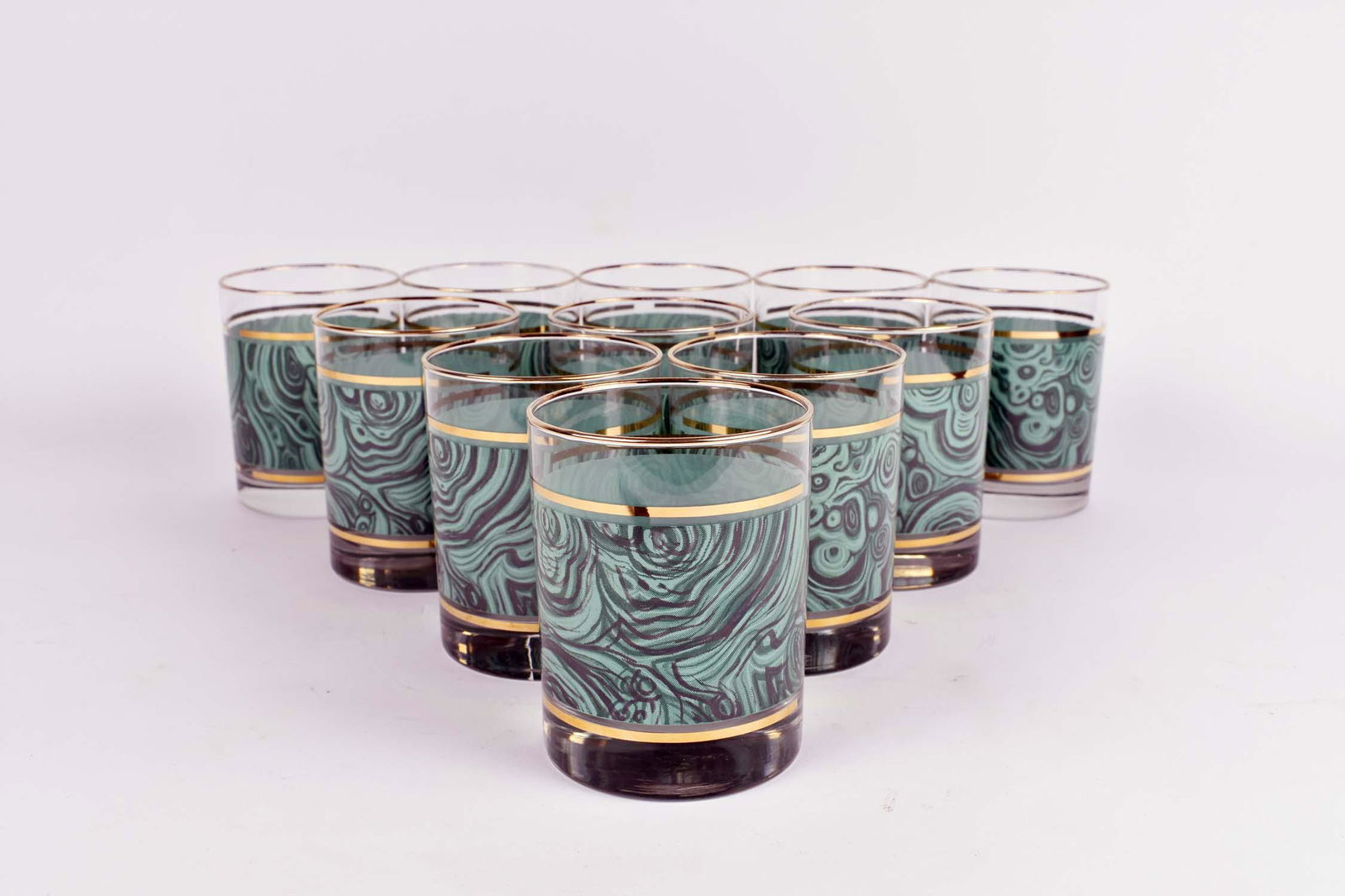 SET OF ELEVEN FAUX MALACHITE DECORATED TUMBLERS: With gilt highlights. Height 4 in. Diameter 3.25 in. (Cond: good)