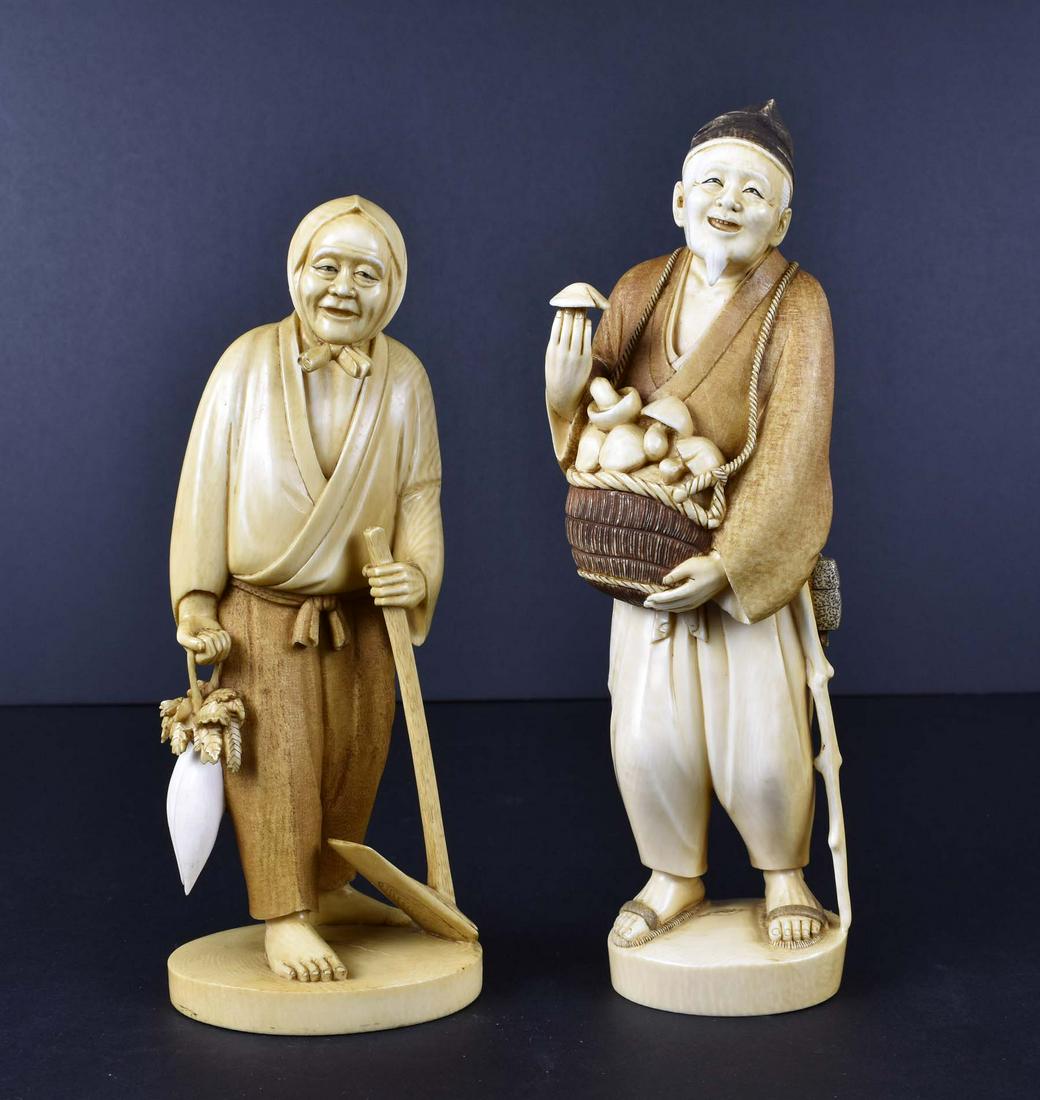 TWO JAPANESE FIGURAL OKIMONO: Meiji period. Each signed on a tablet on the underside. Depicting an old man selling mushrooms, and a peasant woman holding a hoe and carrying vegetables. Heights 9 in., 8.25 in., respectively. (Cond: