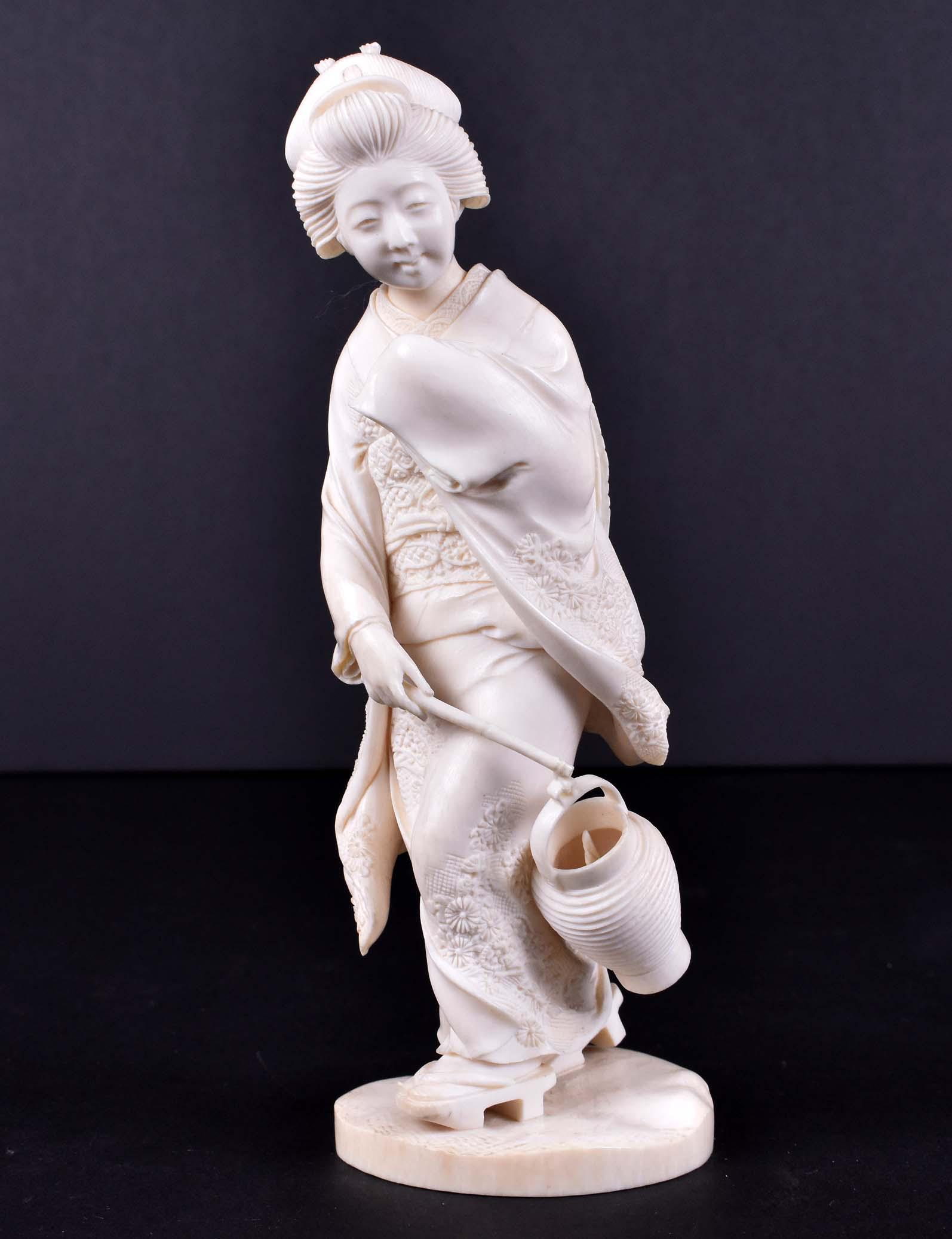 JAPANESE OKIMONO OF A WOMAN WALKING IN THE WIND: Meiji Period. Signed Masaaki (Hamada Masaaki, 1898-1922). Her downward gaze focusing on the flame inside the lantern she carries. Height 7.5 in. (Cond: good)