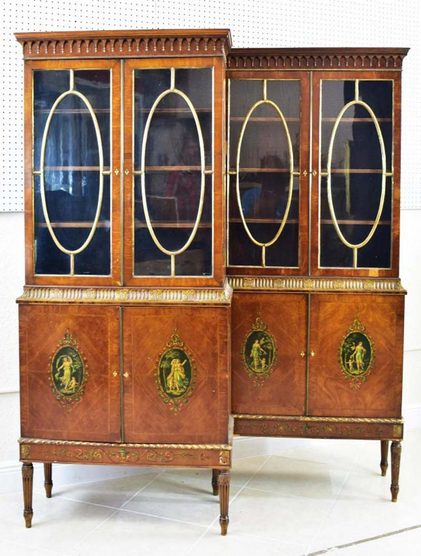 PAIR OF EDWARDIAN PARCEL GILT PAINTED SATINWOOD: Circa 1900, In the manner of Angelica Kaufman. In two parts, the upper with an overhanging cornice with an applied row of pendants, over two glazed doors with gilt carved mullions, the sides decorated