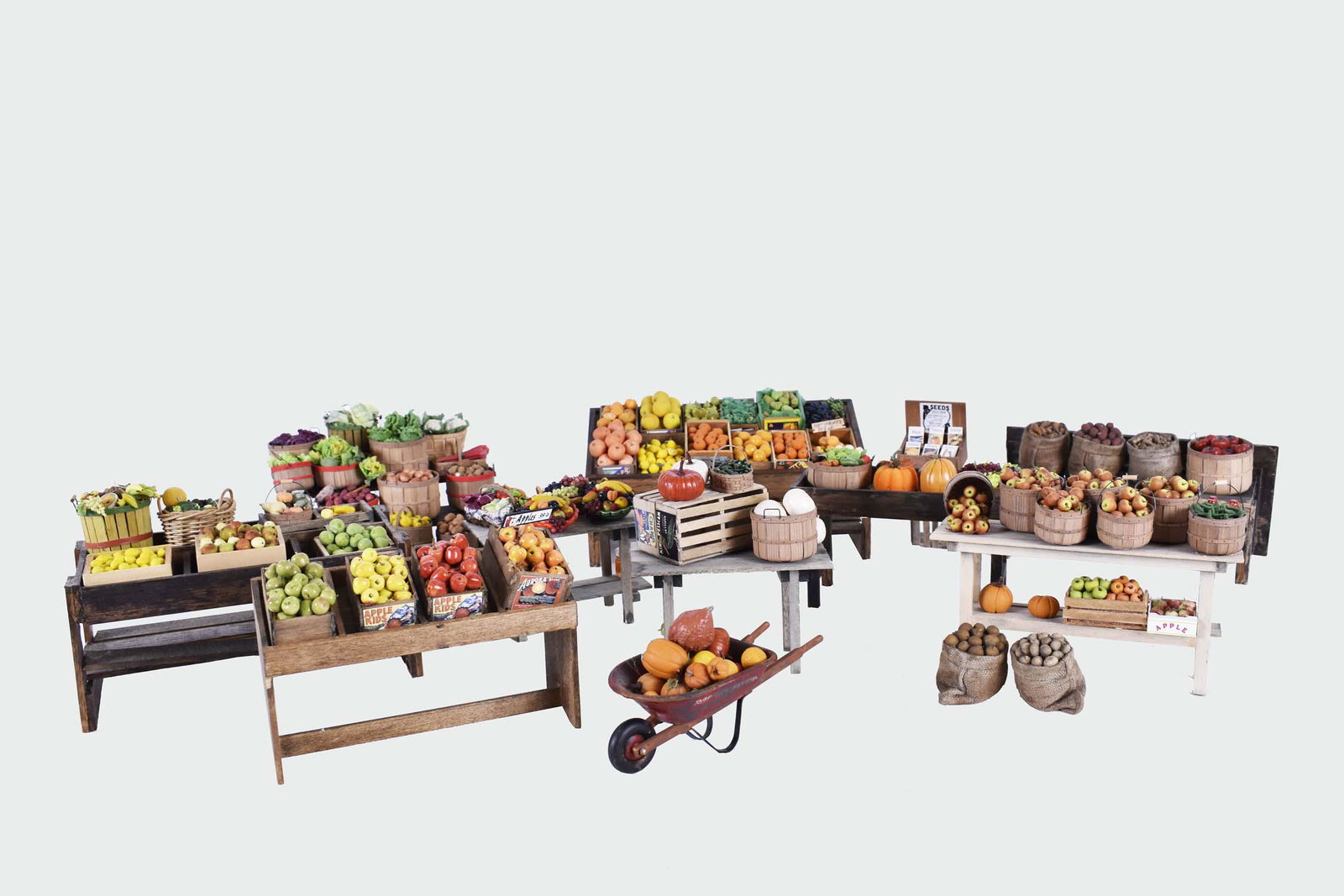 LARGE ASSORTMENT OF COUNTRY FARM STAND MINIATURES: Arranged into flexible ensembles of fixed and loose produce in bushels and crates set upon numerous tables, also with individual moveable elements and fixed potted plants placed on country stands. Siz
