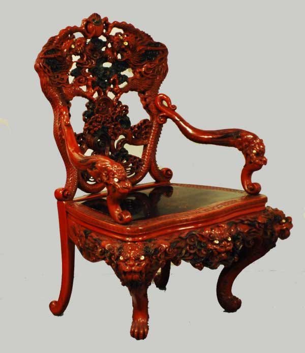 UNUSUAL RED LACQUERED & CARVED WOOD ARM CHAIR