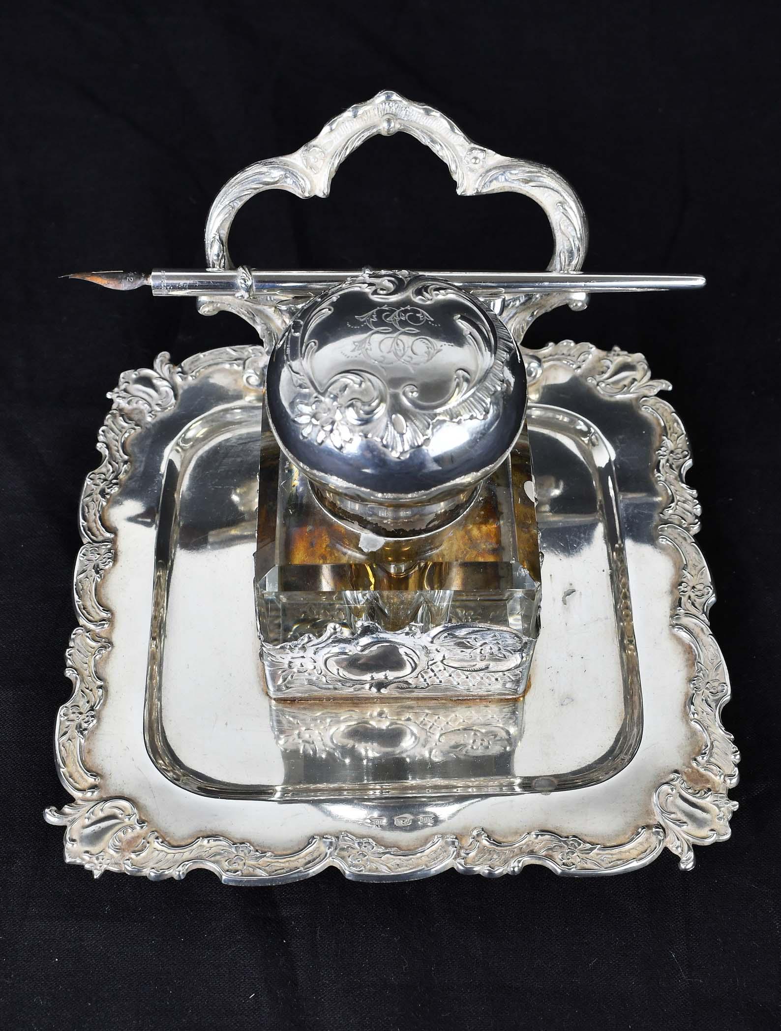 ROCOCO REVIVAL SILVER & GLASS INK STANDISH: Late 19th Century. Probably German. Marked 800, other marks illegible. The recessed center section supporting a glass jar, the silver cap monogrammed, and chased with foliage and scrolls, with an asso