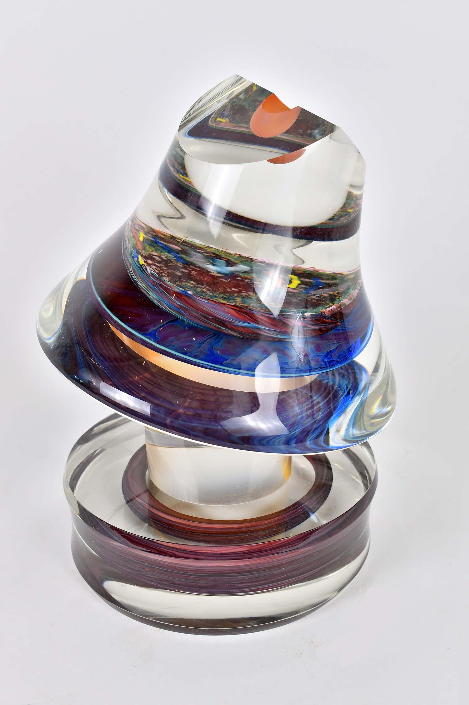 MICHAEL PAVLIK (Czechoslovakian. b. 1941): Internally Decorated Colorless Glass Abstract Sculpture. Signed, dated 1983, numbered 1748. Height 12 in. Diameter 9 in. (approx) (Cond: good) Cf. Michael Pavlik was born in Prague, Czechoslovakia in 