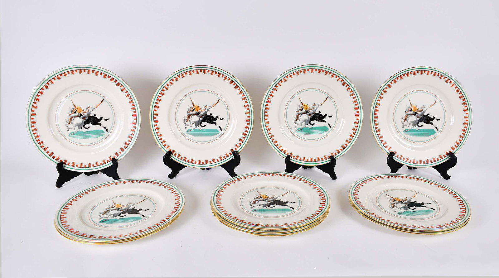 SET OF TWELVE LENOX PORCELAIN EQUESTRIAN SERVICE PLATES: Each marked on the underside, retailed by Black Starr & Frost. Each decorated with two engaged Polo players. Diameter 10.5 in. (Cond: good)