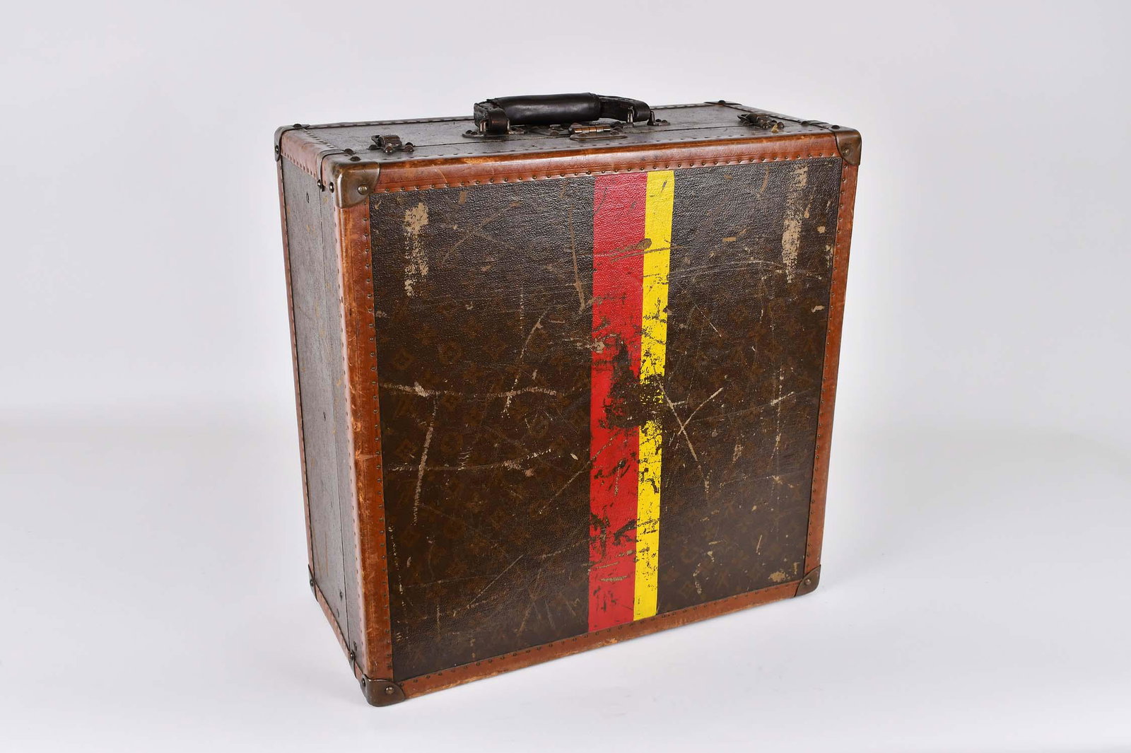 VINTAGE LOUIS VUITTON MONOGRAMMED CANVAS HARD CASE: Incised initials LV, further marked Louis Vuitton / Made in France, the lock numbered 107264, also with Louis Vuitton interior gilt paper label, numbered 817059, and a second, bought from Arthur Gilmo