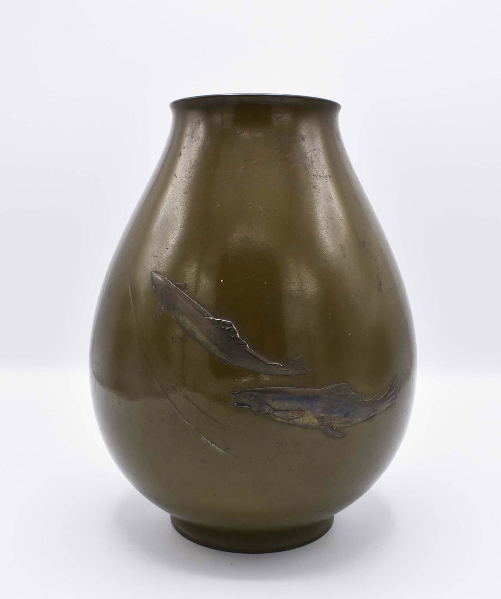 JAPANESE PATINATED BRONZE VASE: Meiji Period. Signed on the side Ryubundo. Of pear shape with two swimming fish, the patina with a green hue. Height 10 in. Diameter at mid body 7.5 in. (Cond: some minor surface imperfections, otherw