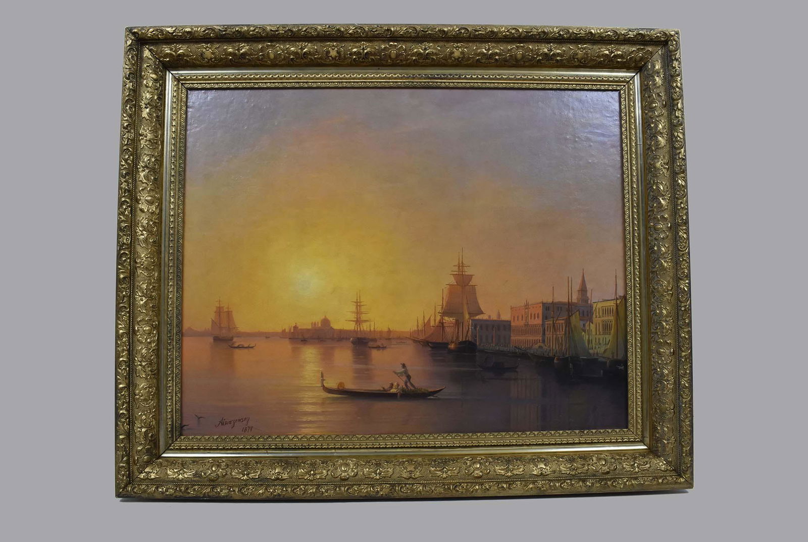 IVAN AIVAZOVSKY (Russian. 1817-1900) PAINTING: In the Manner of. Venice. Signed and dated 1871 lower left. Oil on Canvas. Measuring 22 by 28 in. In a period gesso cast and gilded frame. Overall measures 28.50 by 34 in. (Cond: re-lined with in-pain