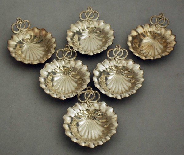 SET OF TWELVE STERLING SILVER NUT DISHES