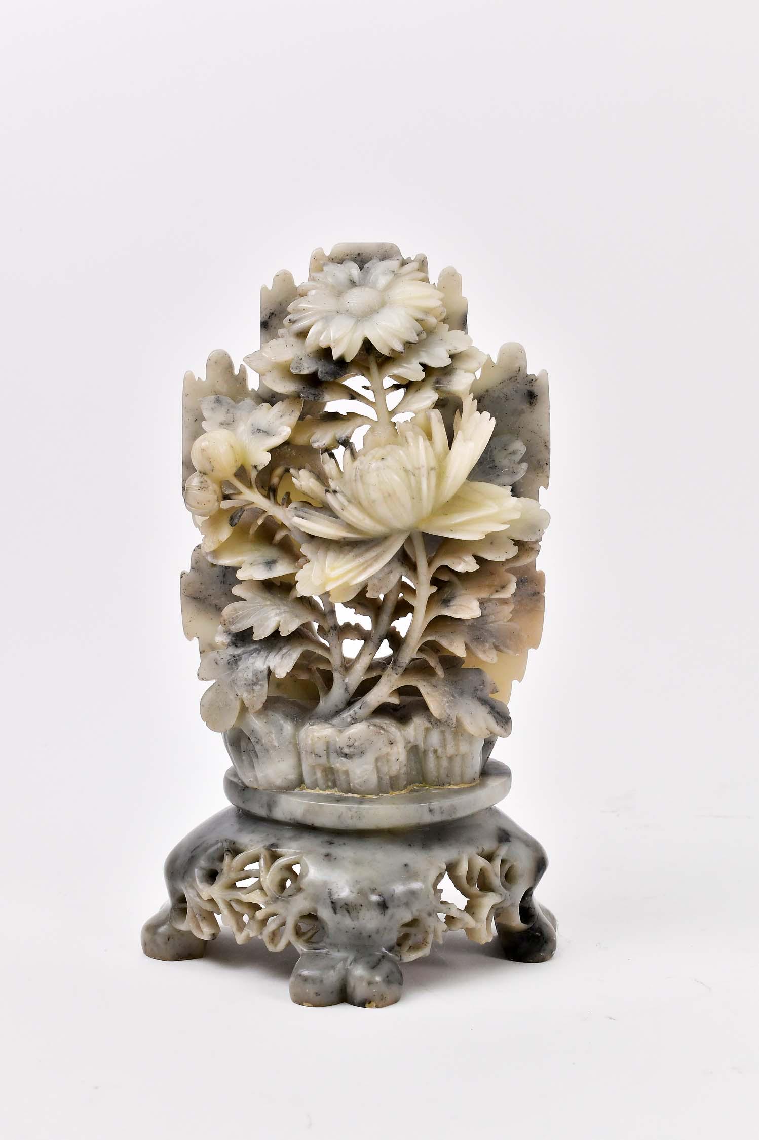 CHINESE BLACK & WHITE SOAPSTONE FOLIATE GROUP: 20th Century. The black and white mottled blossoming foliage growing forth from rock work, on an open-work conforming base. Height 10 in. Width 6.25 in. (Cond: good)