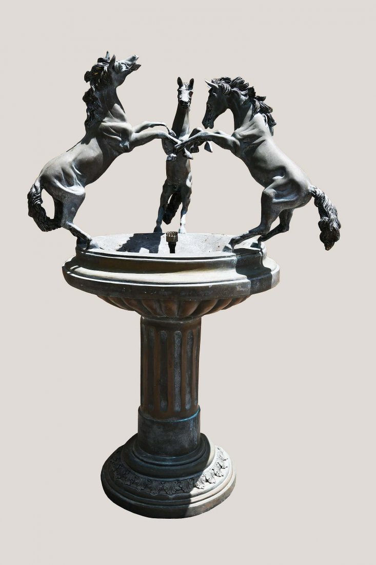 BAROQUE STYLE PATINATED BRONZE FOUNTAIN: Early 20th Century. Depicting three horses in a rearing pose, atop a circular basin, on a fluted columnar base. Height 53 in. Diameter 33 in. (approx.). (Cond: some weathering, overall good)