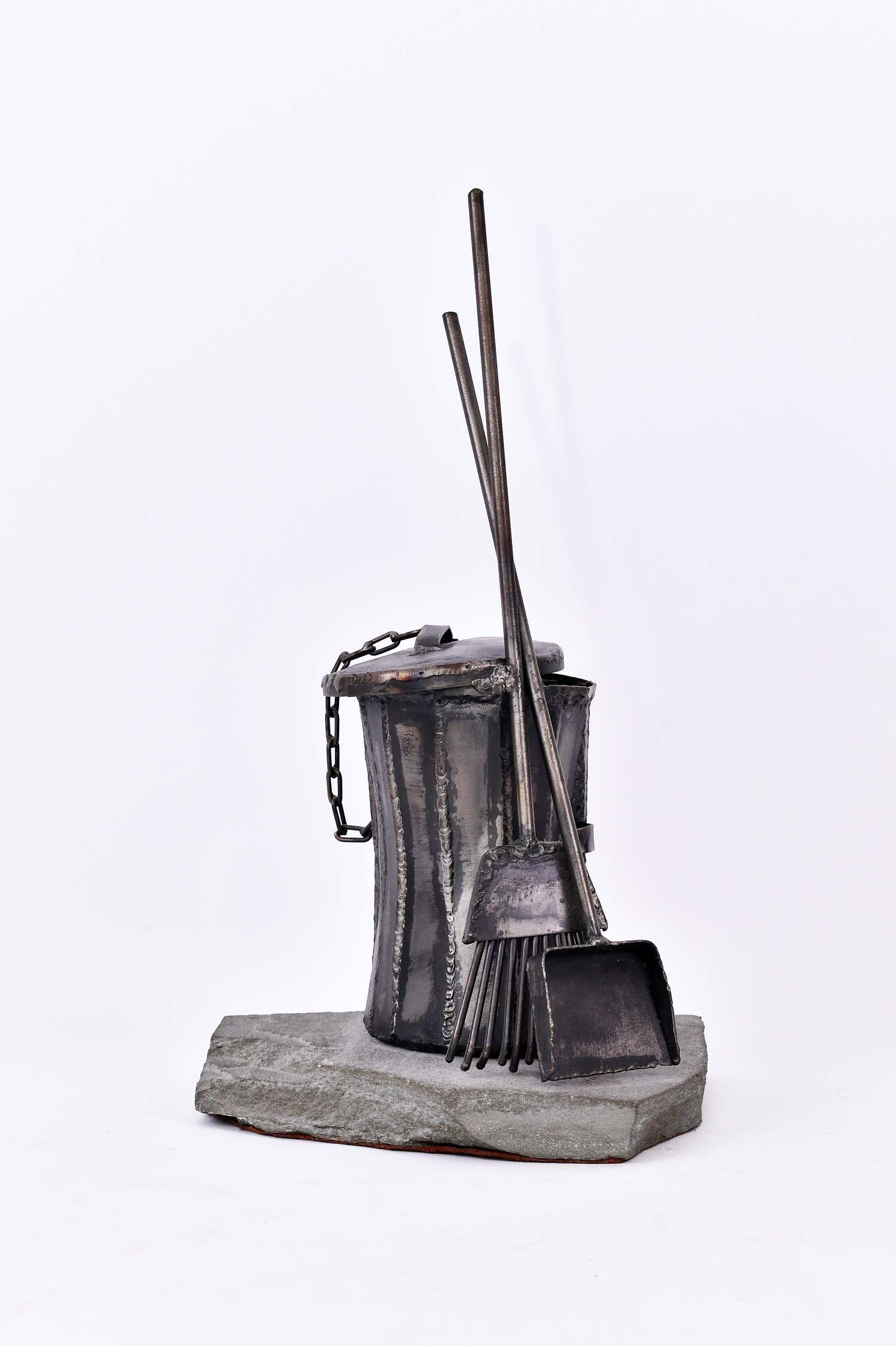 VARIOUS METAL OUTDOOR TRASH CAN SCULPTURE: Contemporary. The realistic modeled can with lid, supporting a broom and dust pan. Height overall 19 in. (Cond: good)