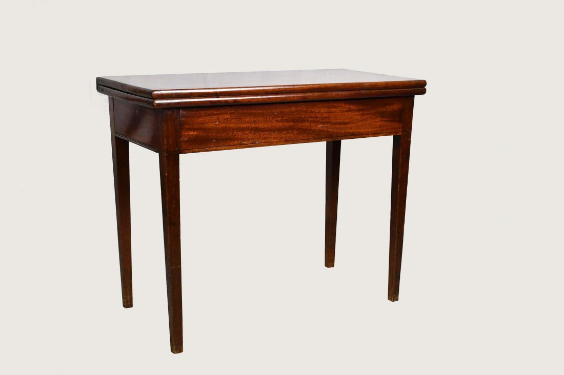 GEORGE III MAHOGANY GAMES TABLE: Late 18th/Early 19th Century. The rectangular top opening to a plain surface, on straight tapering square legs. Height 27 in. Width 33 in. Depth 16 in. (Cond: good, nice color)