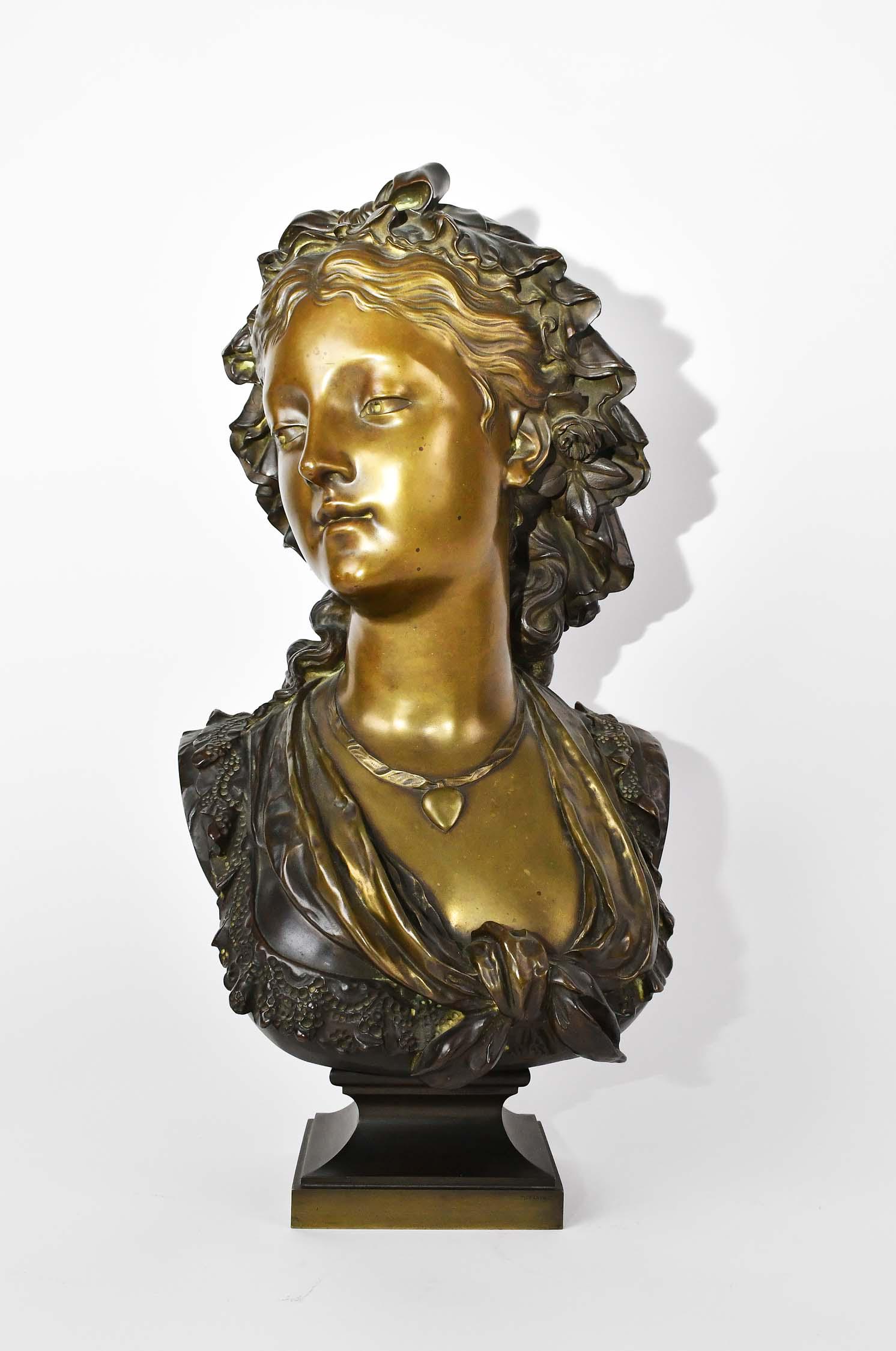 EUGENE-ANTOINE AIZELIN (French. 1821-1902) SCULPTU: Patinated Bronze Bust of a Young Maiden. Signed E. Aizelin on the left shoulder. Impressed Tiffany & Co. on the base. Overall Height 23 in. Width 9.5 in. Depth 9 in. (Cond: good, greenish-copper color