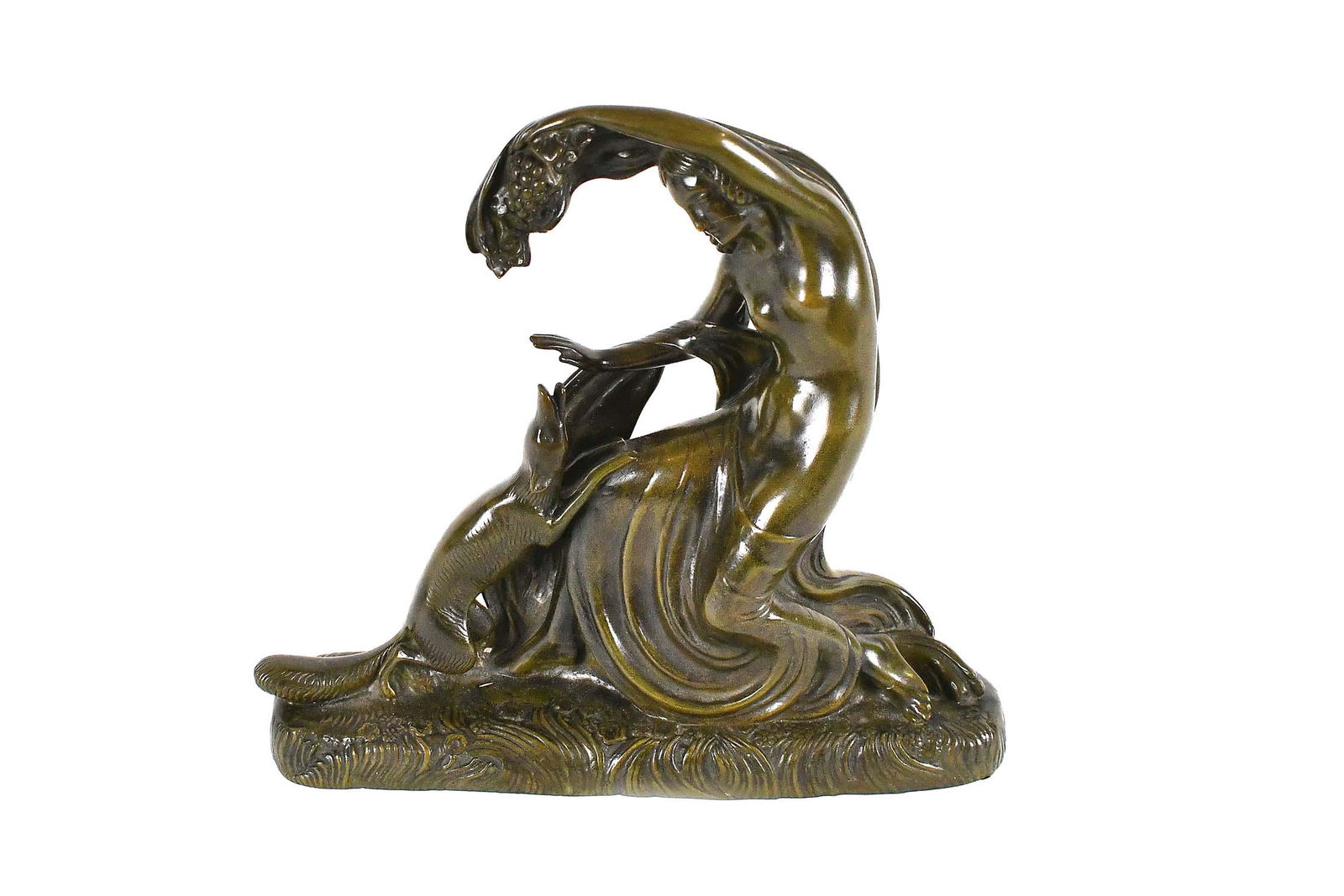 GUSTAVE GILLOT, ART DECO PATINATED BRONZE OF POMONA: Signed G. Gillot (French. 1888-1965). The scantily clad classical goddess with one arm raised grasping a grape cluster, a fox begging at her knee, on a shaped base, with a verdant green patina. Height