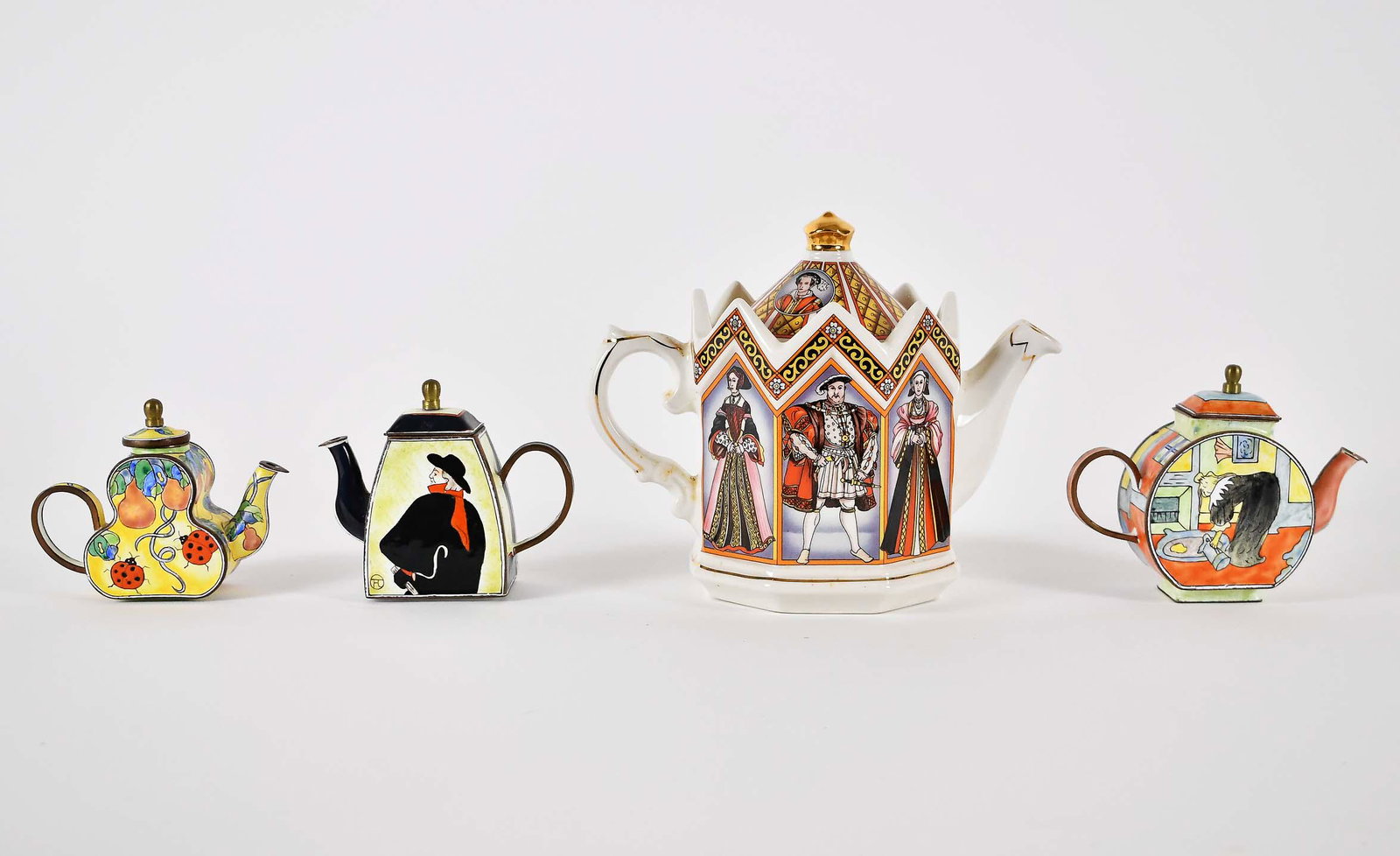 ENGLISH EARTHENWARE HENRY VIII & SIX WIVES TEAPOT: Together with Three Kelvin Chen Enameled Miniature Teapots. The first, circa 1900, titled and marked Sadler, shaped as a tower, depicting the King and his six wives. The miniatures variously shaped, t