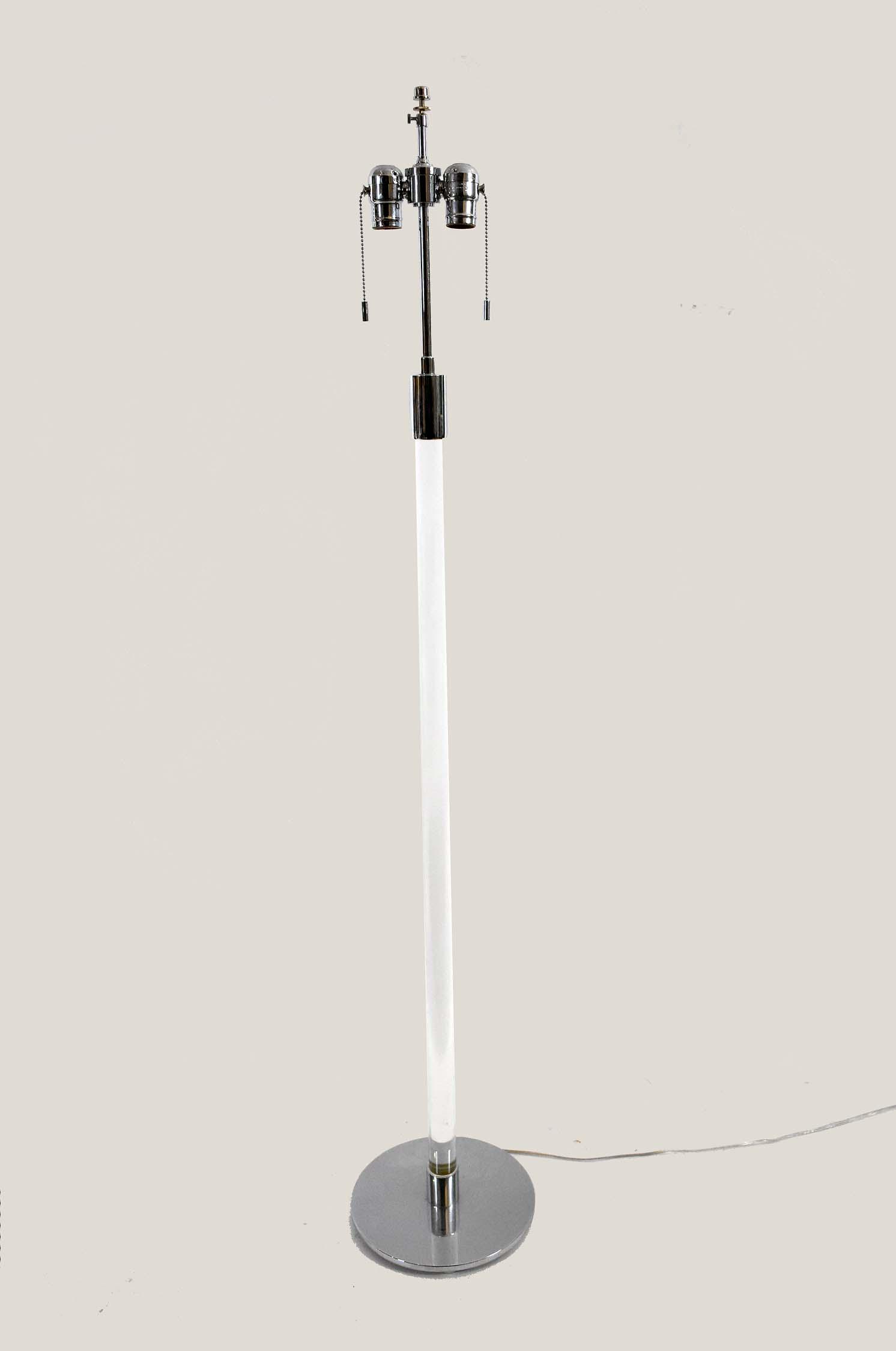 CONTEMPORARY LUCITE AND CHROME FLOOR LAMP: Hansen Lamp, Inc., New York. The columnar shaft on a circular base. Height 56 in.