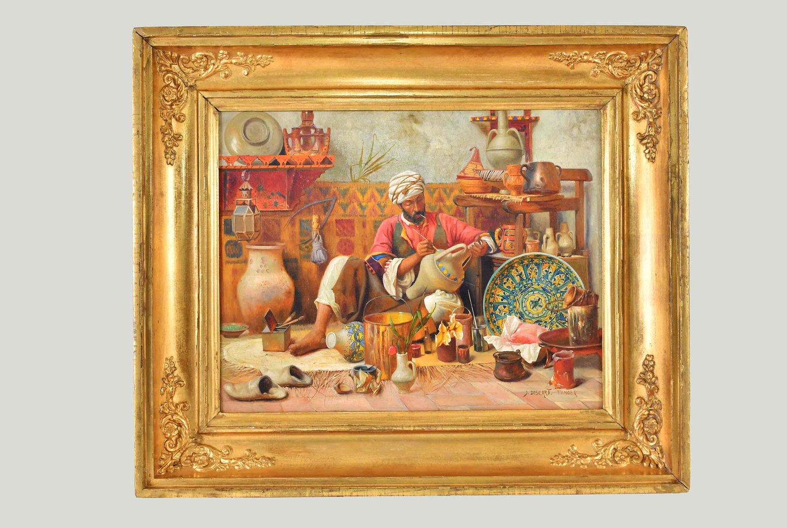 AFTER JEAN DISCART (French. 1856-1944) Painting: Le Atelier de Poterie, Tanger. Inscribed J. Discart, Tanger. Oil on Canvas. Measuring 14.5 by 18.25 in., overall 21 by 25 in. cf. The offered lot, a copy of the Artist's work of the same title, sold S