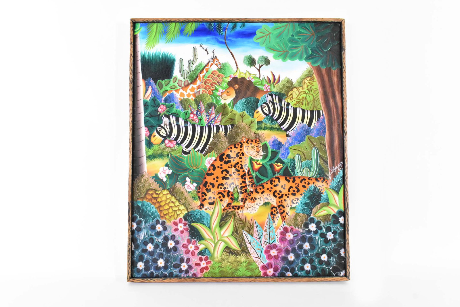 JEROME POLYCARPE (Haitian. b. 1950) Painting: Wildlife Menagerie in a Lush Jungle, 1981. Signed, dated m/r. Oil on Canvas. Measuring 25 by 20.75 in.