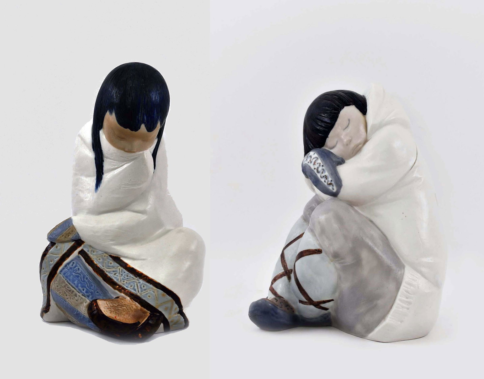 LLADRO PORCELAIN FIGURES OF AN INUIT GIRL & BOY: Each signed, numbered. Seated and wrapped in a blanket. Height 10.5 in. Width 5.5 in. (Cond: good)