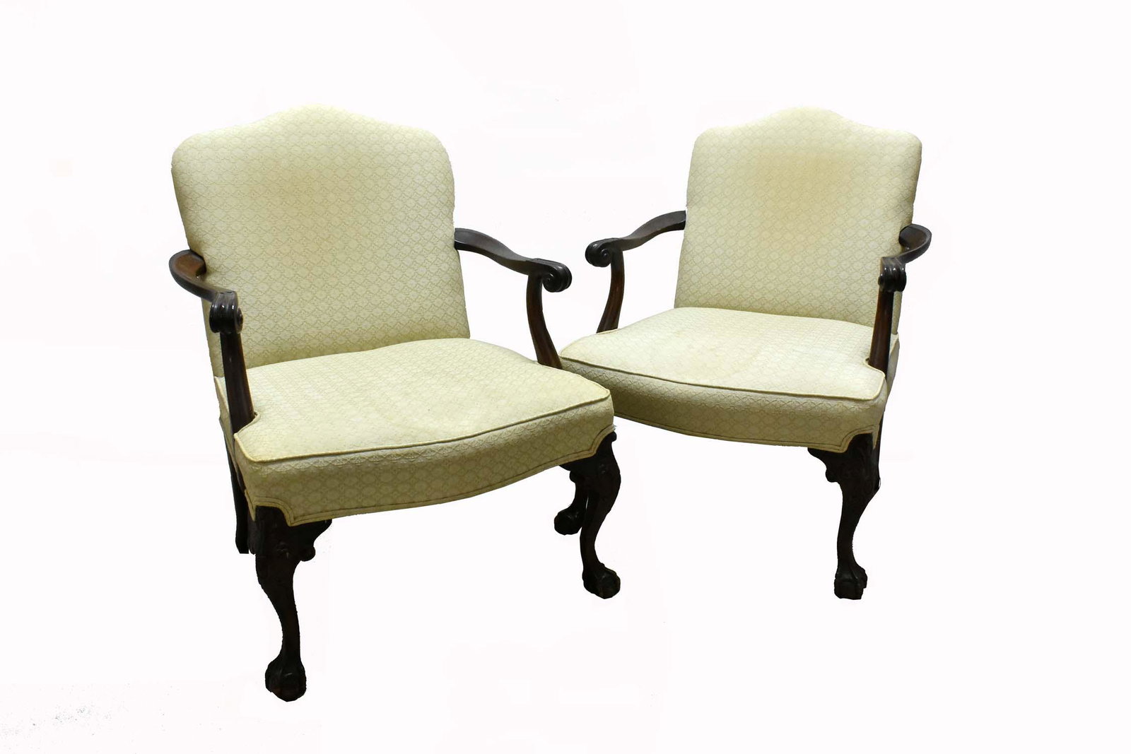 PAIR OF GEORGE III STYLE MAHOGANY LIBRARY ARMCHAIRS: The upholstered backs and seats with scrolled arms, on voluted supports, the cabriole legs ending in claw-and-ball feet. Width of seat between arms. Provenance: Property of The Haggstrom Trust, Jupite