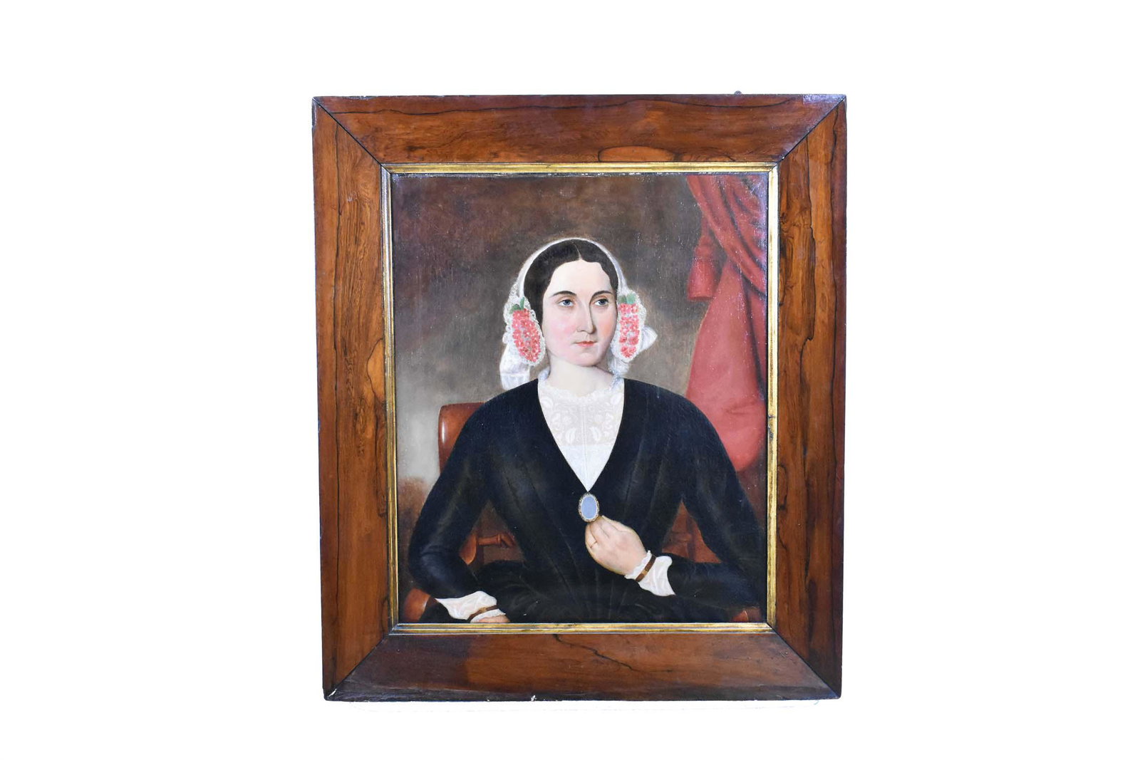 ENGLISH SCHOOL (19th Century) PAINTING: Portrait of a Lady with Bonnet and Locket. No visible signature. Oil on Canvas. 30 x 25 inches. Original canvas and stretchers. Surface has overall crazing. Rosewood veneered frame. Some imperfections