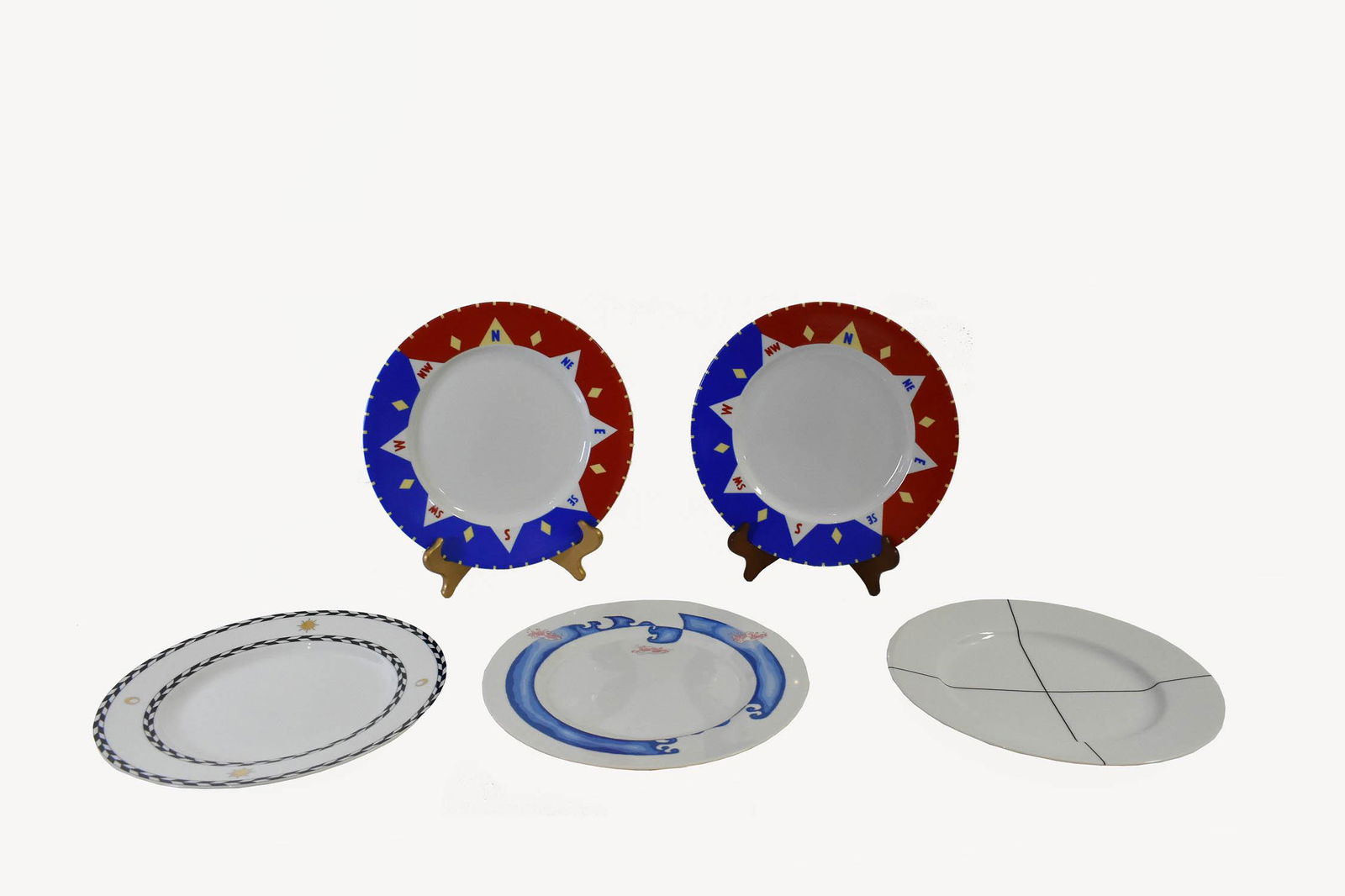 FIVE SWID POWELL PORCELAIN SERVICE PLATES: Each marked, titled. Comprising: a Signature Black, a Heaven, two South Shore examples and an Atlantis example. Diameter 12 in.