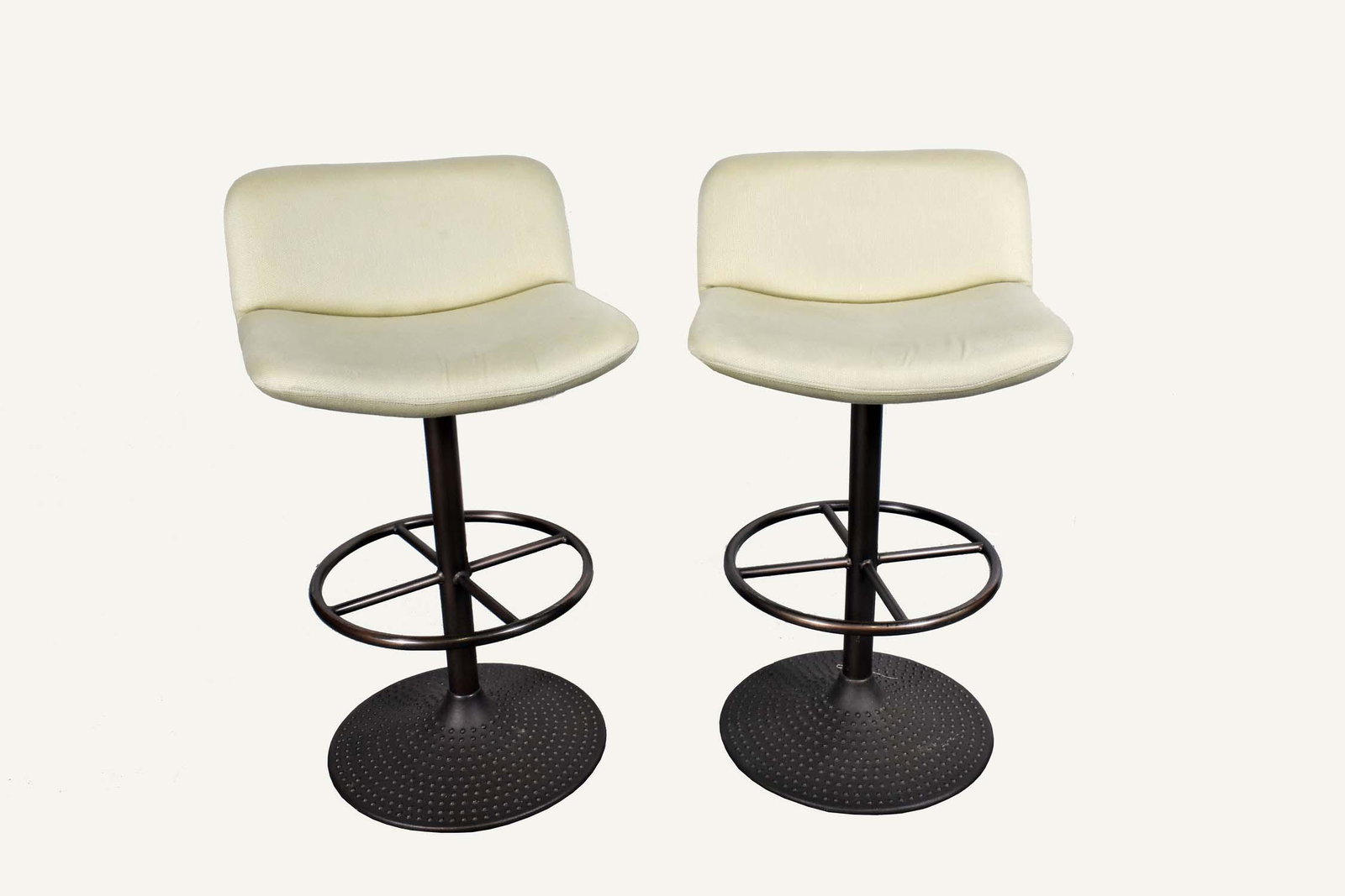 PAIR OF CONTEMPORARY COUNTER STOOLS/CHAIRS: Each with a revolving adjustable upholstered low back and seat, on copper patinated steel supports. Height back to floor 34 in. Width of seat 19 in. Depth of seat 19 in.