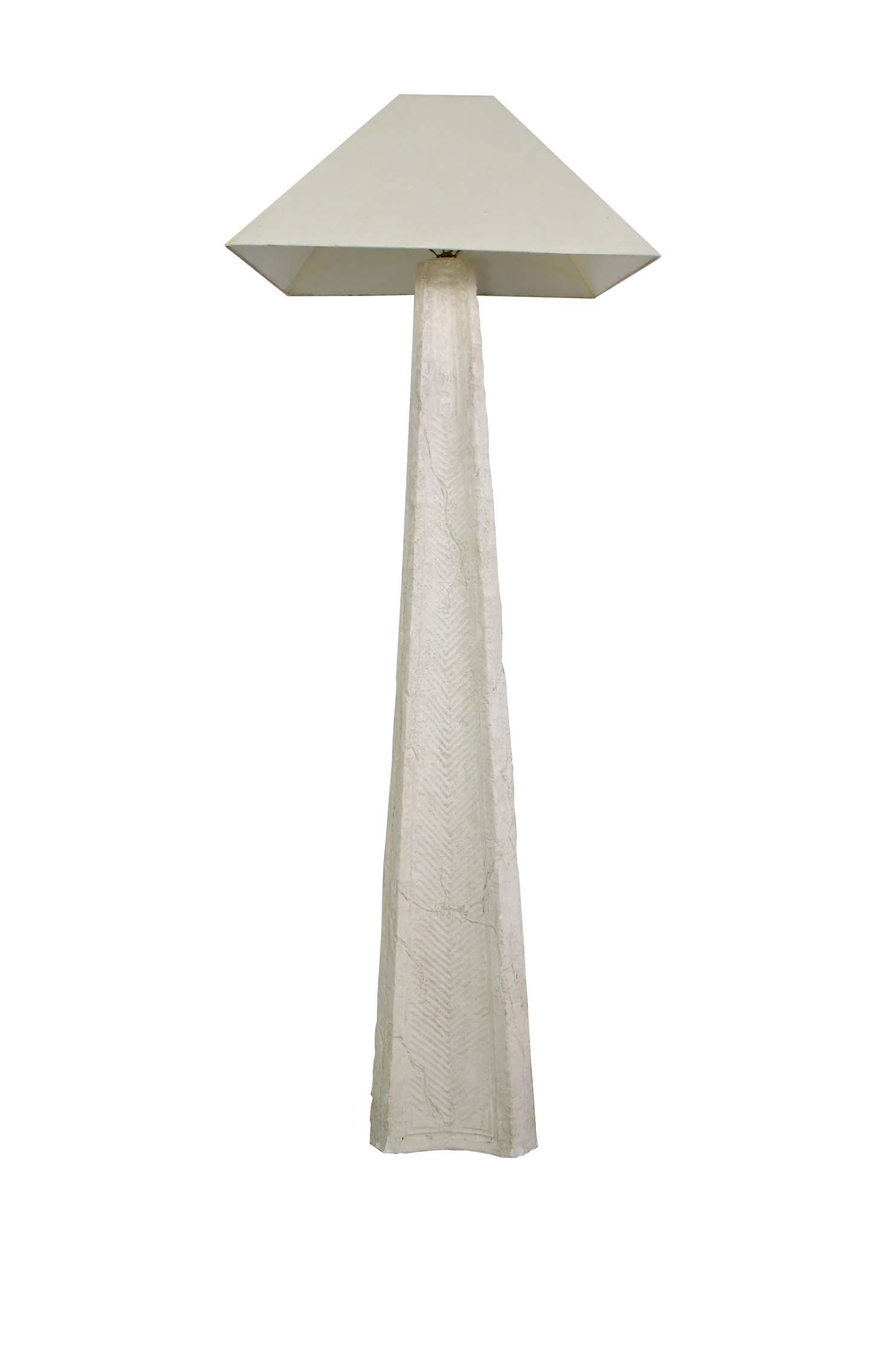 CONTEMPORARY CARVED LIMESTONE FLOOR LAMP: The flared form standard of triangular outline carved in relief with scattered ferns. Height 60 in., overall 6 ft. 7 in. (Cond: good)