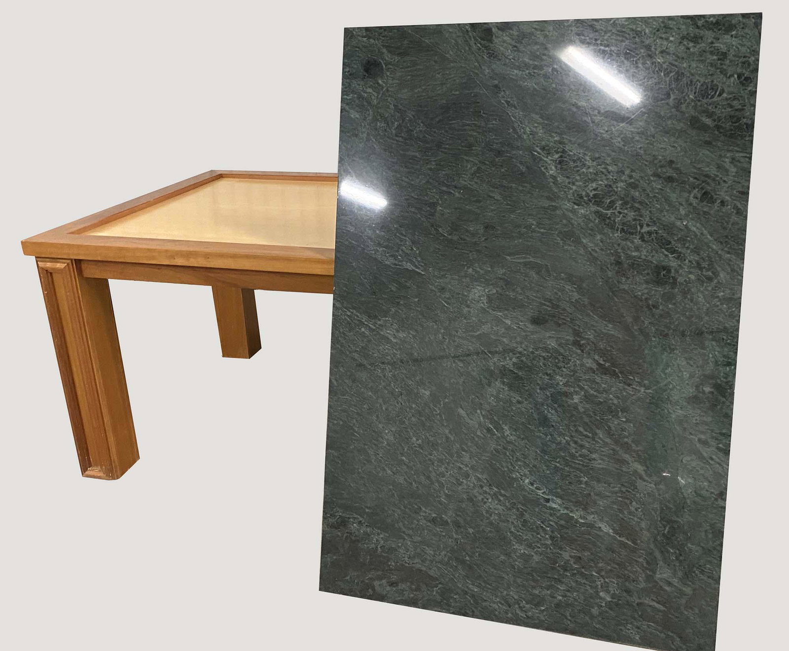 TRADITIONAL MARBLE INSET MAPLE CENTER TABLE: Modern. Rectangular, with a white veined marble top, above a plain frieze, on straight molded legs. Height 34 in. Width 65 in. Depth 42 in. (Cond: good)