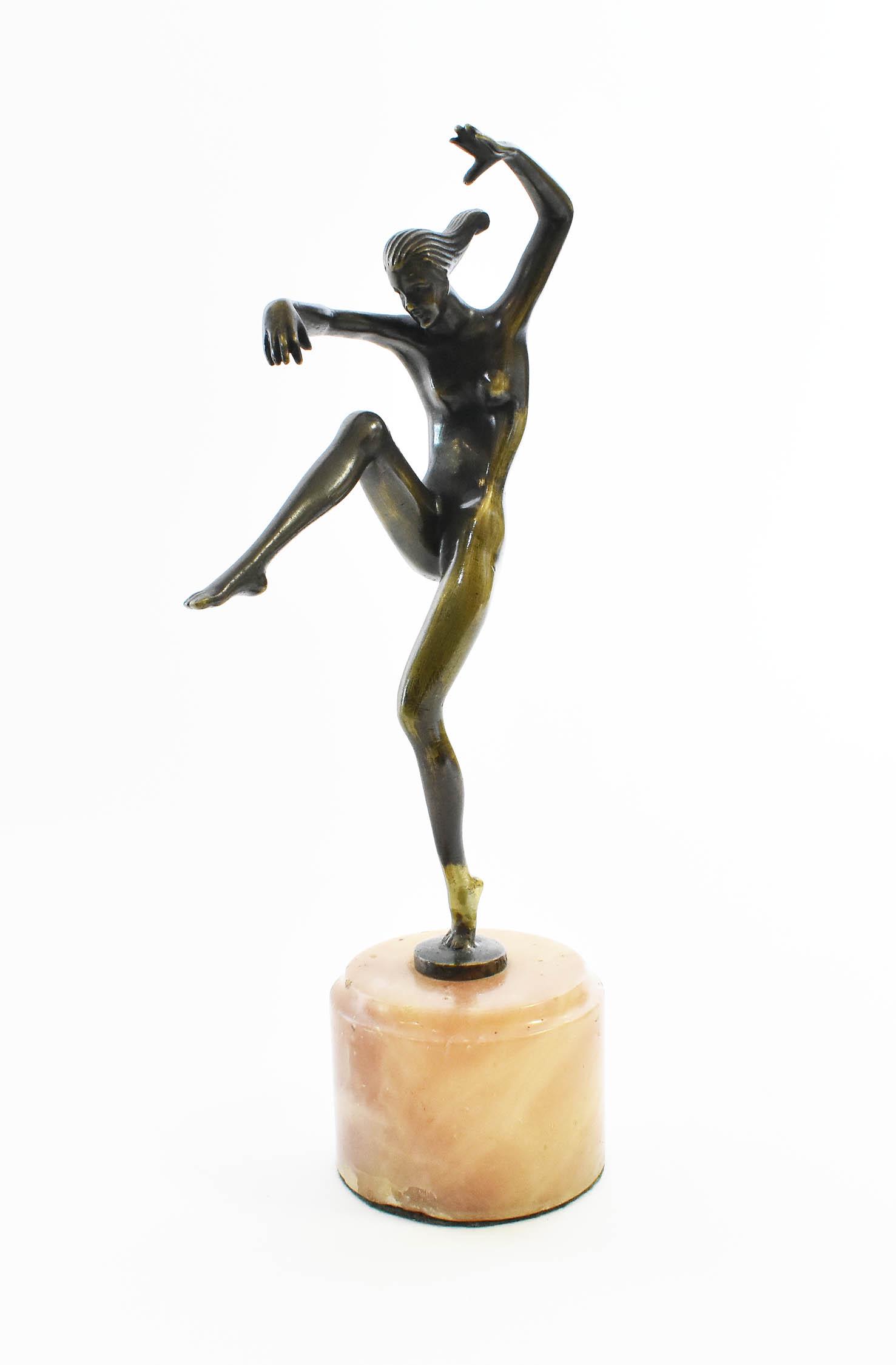STEFAN DAKON (Austrian. 1904-1992) BRONZE: Art Deco Female Nude Dancer, signed Dakon, atop a cylindrical onyx base. Height 11.5 in. overall.