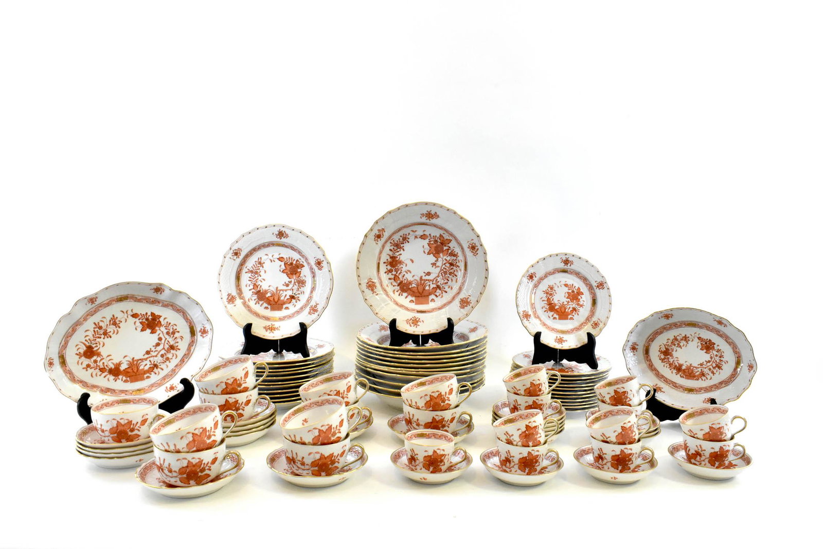HEREND 130 PIECE INDIAN BASKET PORCELAIN DINNER SERVICE: Marked with underglaze factory marks. The extensive service comprising,: twenty-three dinner plates, twelve soup plates, twelve luncheon plates, twelve salad plates, twelve teacups (one damaged), twel