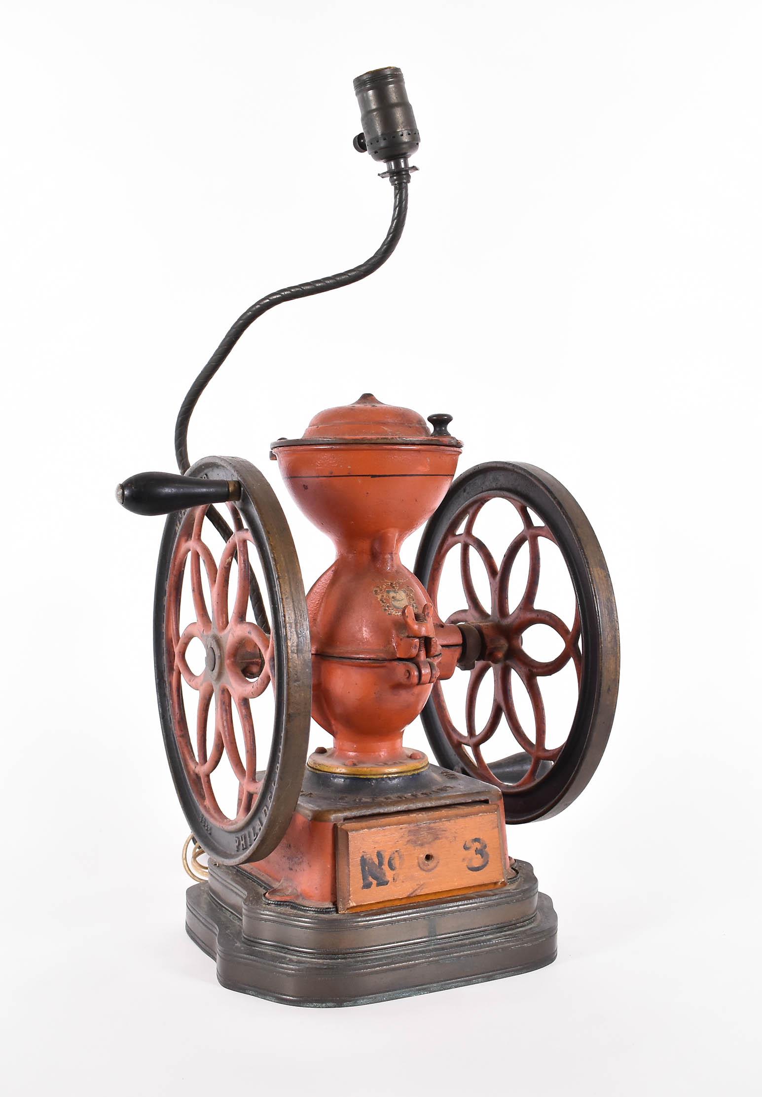ANTIQUE PAINTED COFFEE GRINDER MOUNTED AS A LAMP: Antique Painted Coffee Grinder Mounted as a Lamp. Early 20th Century. Height 14.5 in., Overall 23 in. (Cond: adapted)
