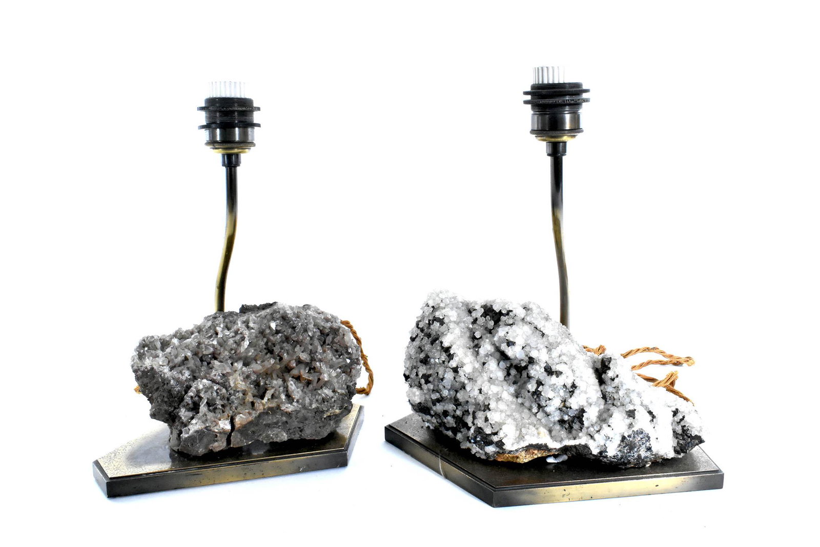 TWO ANTIQUE QUARTZ MINERAL SPECIMANS MOUNTED AS LAMPS: Each symmetrical, with colorless to white translucent quartz crystals dotted with grayish-black crystals, on shaped bronze bases. Heights 4 in., 4.5 in., Widths 7.5 in., 10 in.(Cond: some minor losses