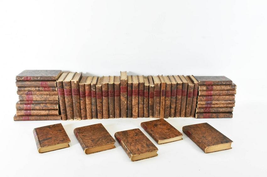 FORTY-SIX ANTIQUE FRENCH LEATHER BOUND BOOKS: Albin Michel, Editeur, 1926. Brown marbleized paper mounted covers. Height 7.25 in. Depth 5 in. (Cond: some paper discoloration to all, minor spine damage to some, some torn, tattered inside front, ba
