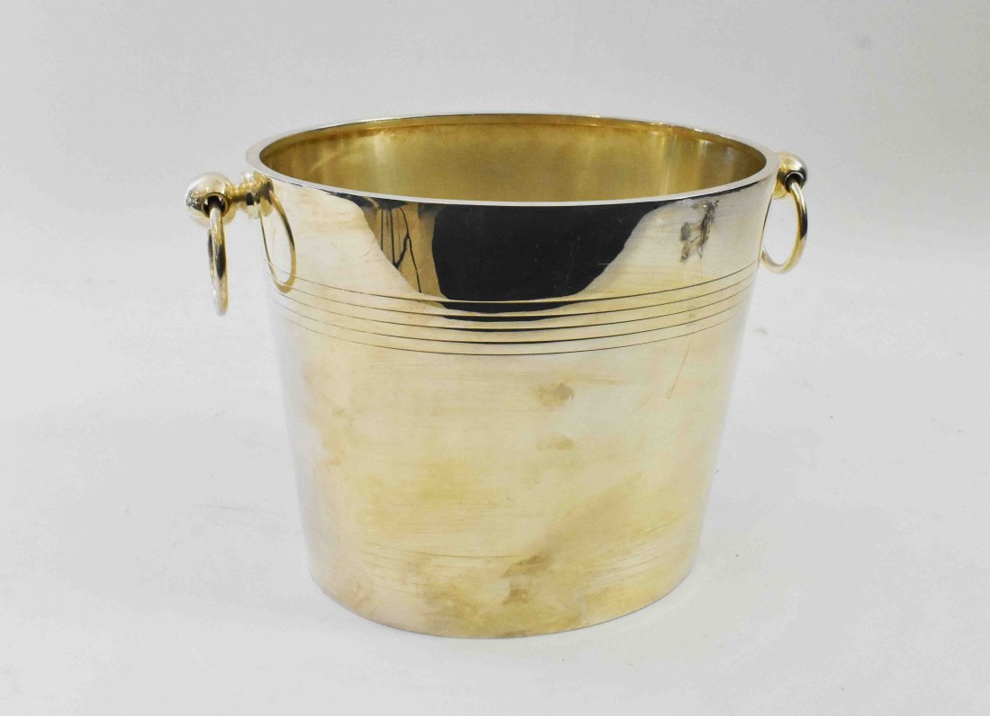 CHRISTOFLE SILVERPLATE ICE BUCKET: Mid 20th Century. Marked on the underside. Oval, with ring handles at the side, and incised linear bands. Together with two silver plate nut crackers and a grape shears. (4 pieces) Height 8.5 in., Wid