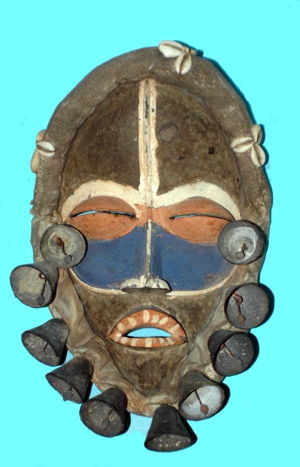 AFRICAN BAKUBA TRIBAL MASK: AFRICAN BAKUBA TRIBAL MASK Democratic Republic of Congo. Wood, led ochre and white pipe clay polychrome painting, burlap and cowrie shells. Height 14 1/2". (Cond: normal wear) (60/80)