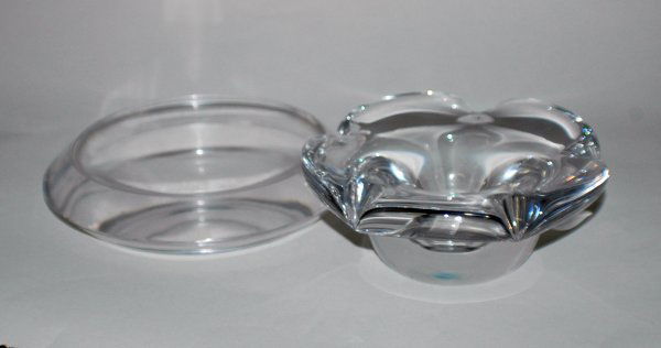 TIFFANY & CO. CRYSTAL ASHTRAY: TIFFANY & CO. CRYSTAL ASHTRAY Signed. Diameter 7". Together with a Daum Nancy crystal ashtray. Signed. Diameter 6". (2 pcs) (50/80)