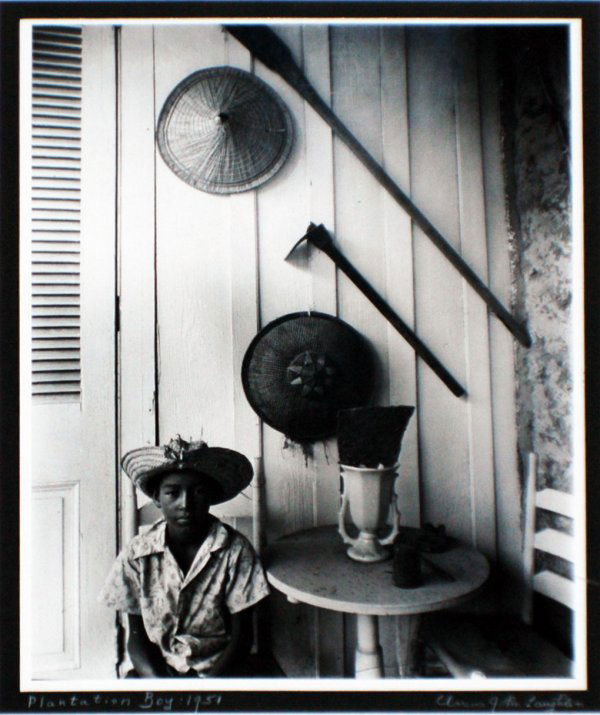 CLARENCE JOHN LAUGHLIN (American. 1905-1985): CLARENCE JOHN LAUGHLIN (American. 1905-1985) "Plantation Boy". Signed, titled and dated 1951 on the mat. Black & White Photograph. Measuring 13 1/4" by 10 1/2". Chrome frame. (Cond: good) (800/1000)